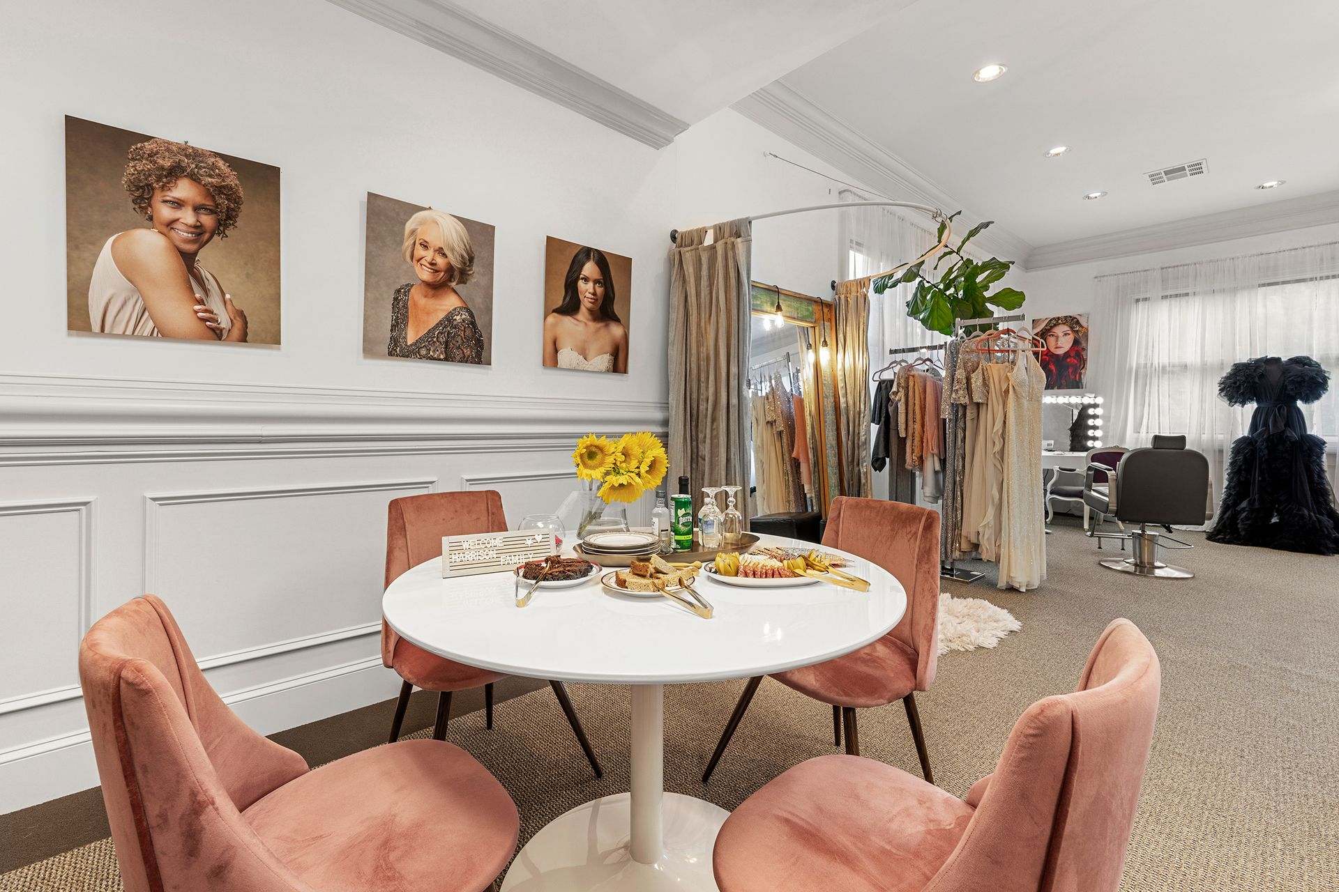 There is a table and chairs in the middle of the room.