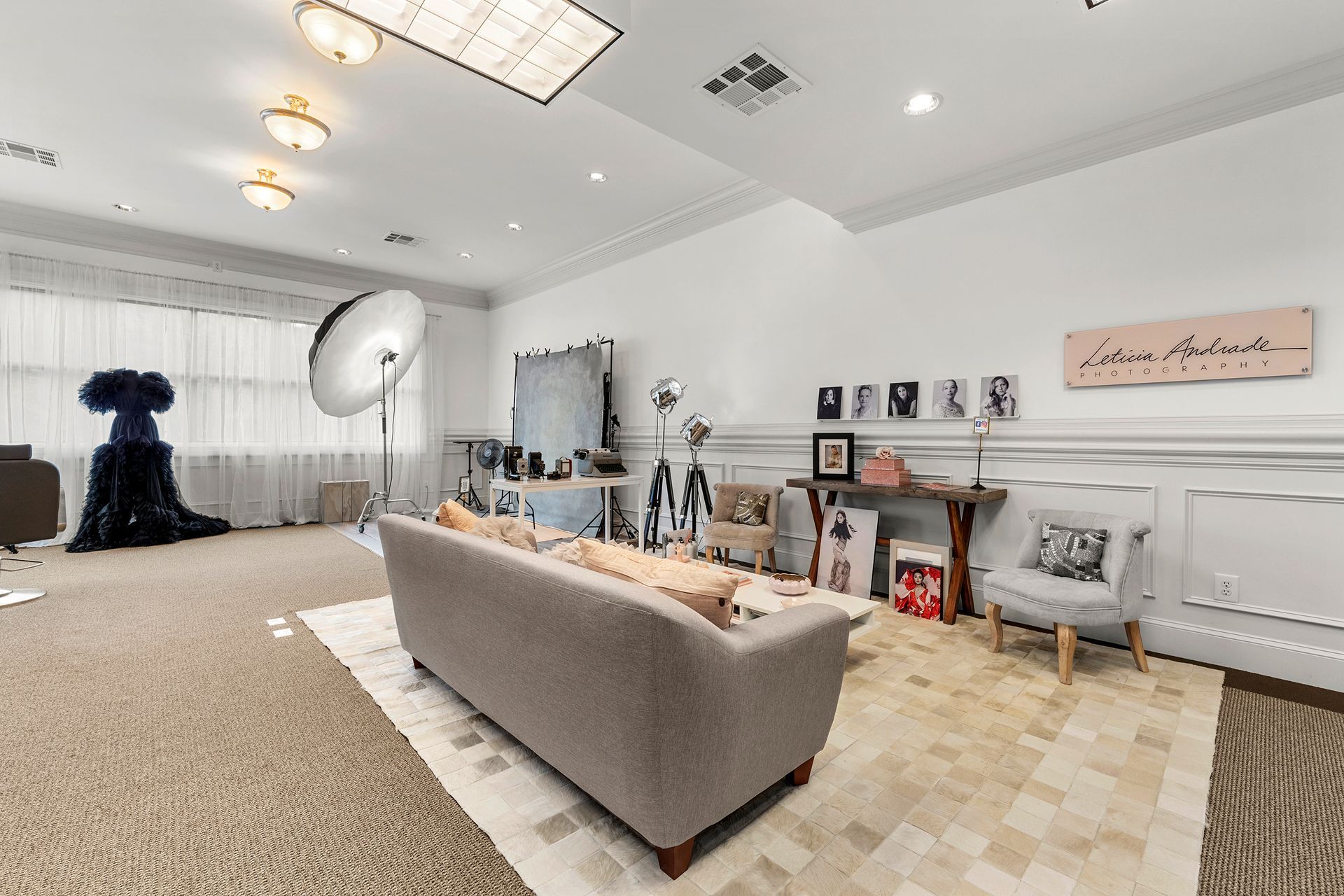 A living room with a couch and a rug