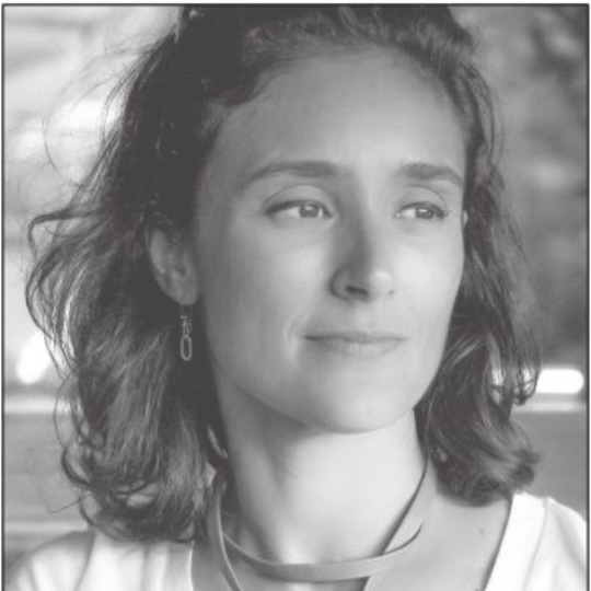 A black and white photo of a woman wearing a necklace