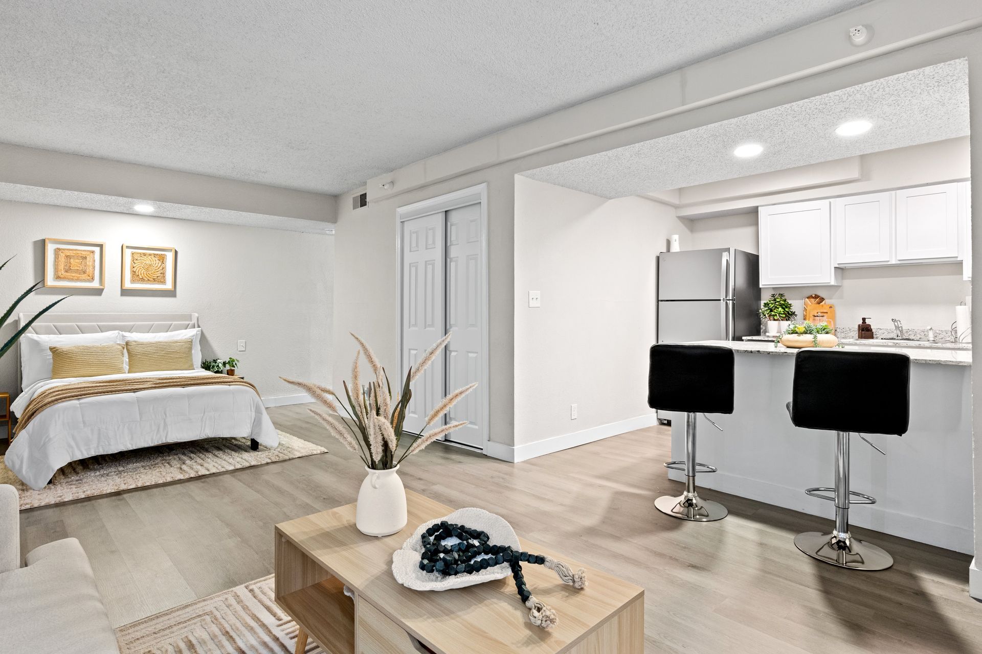 Property manager meeting with a homeowner to discuss single-family home property management services in Tulsa, including leasing, rent collection, maintenance coordination, and financial reporting. Tenant using a computer to communicate with property management and submit a maintenance request for a single-family rental home managed by KSA Property Management in Tulsa, Oklahoma