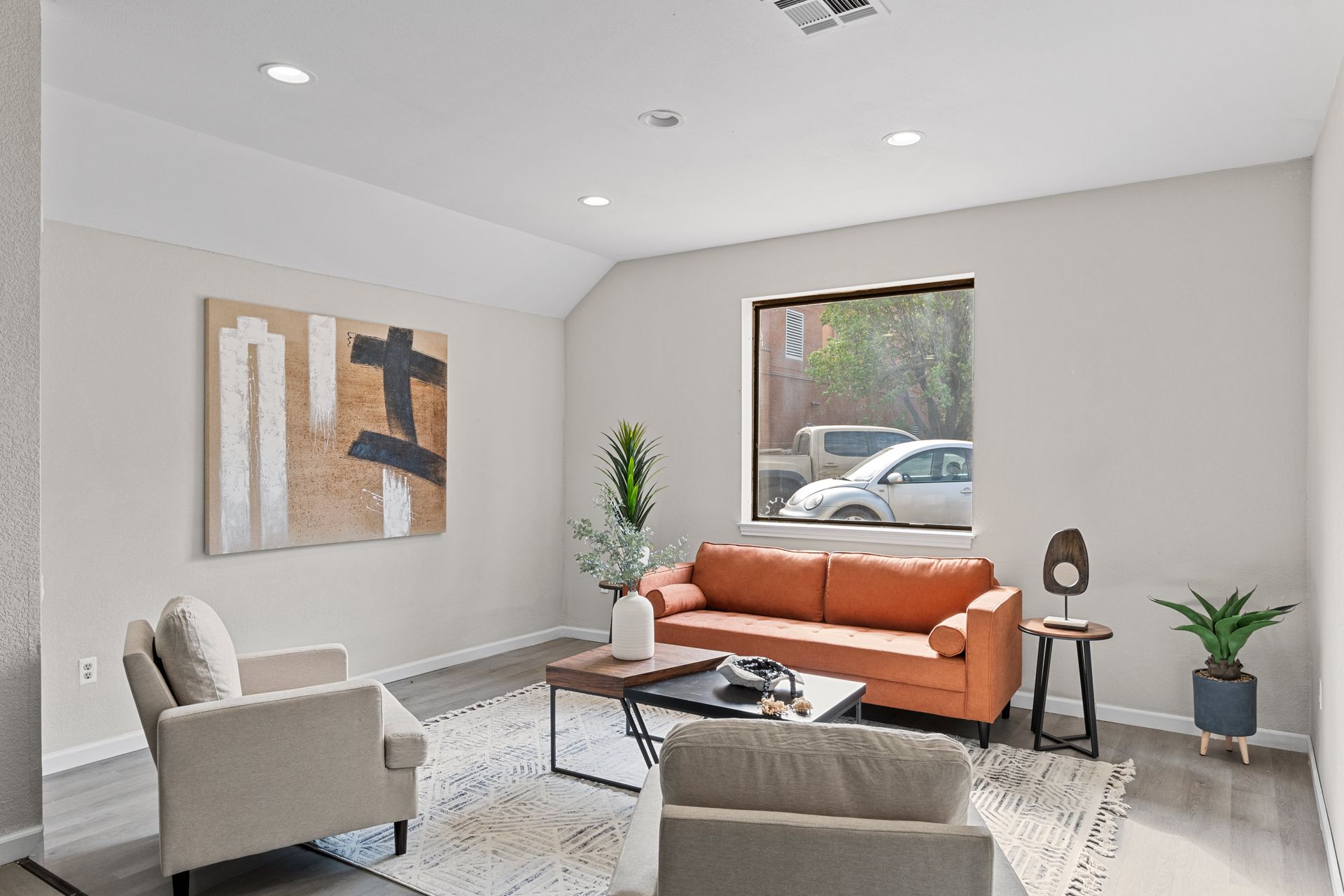 Property manager meeting with a homeowner to discuss single-family home property management services in Tulsa, including leasing, rent collection, maintenance coordination, and financial reporting. Tenant using a computer to communicate with property management and submit a maintenance request for a single-family rental home managed by KSA Property Management in Tulsa, Oklahoma