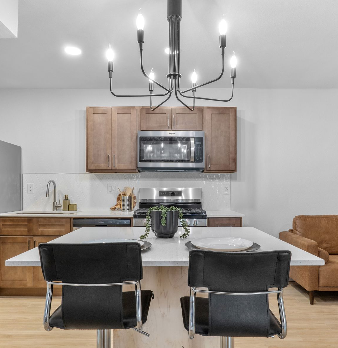 Bright, modern Tulsa, Oklahoma apartment living room with floor-to-ceiling windows, sleek furnishings, and a view of the city skyline
property community lease lease community community community management washer gated community apartments balcony property lease balcony property community