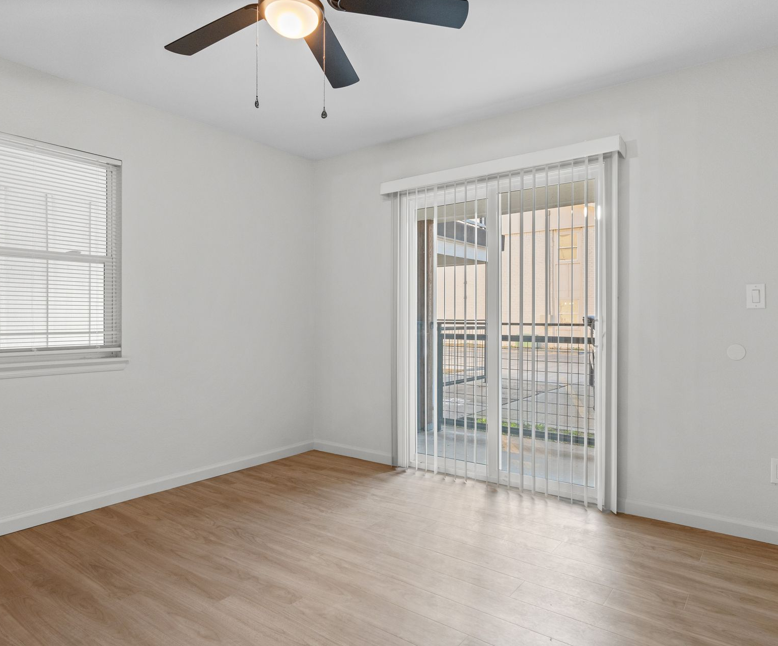 Spacious modern apartment interior in Tulsa, Oklahoma with floor-to-ceiling windows, sleek hardwood floors, and minimalist furnishings
apartments management lease lease management asset management gated community bathroom management map community lease community apartments apartments property map