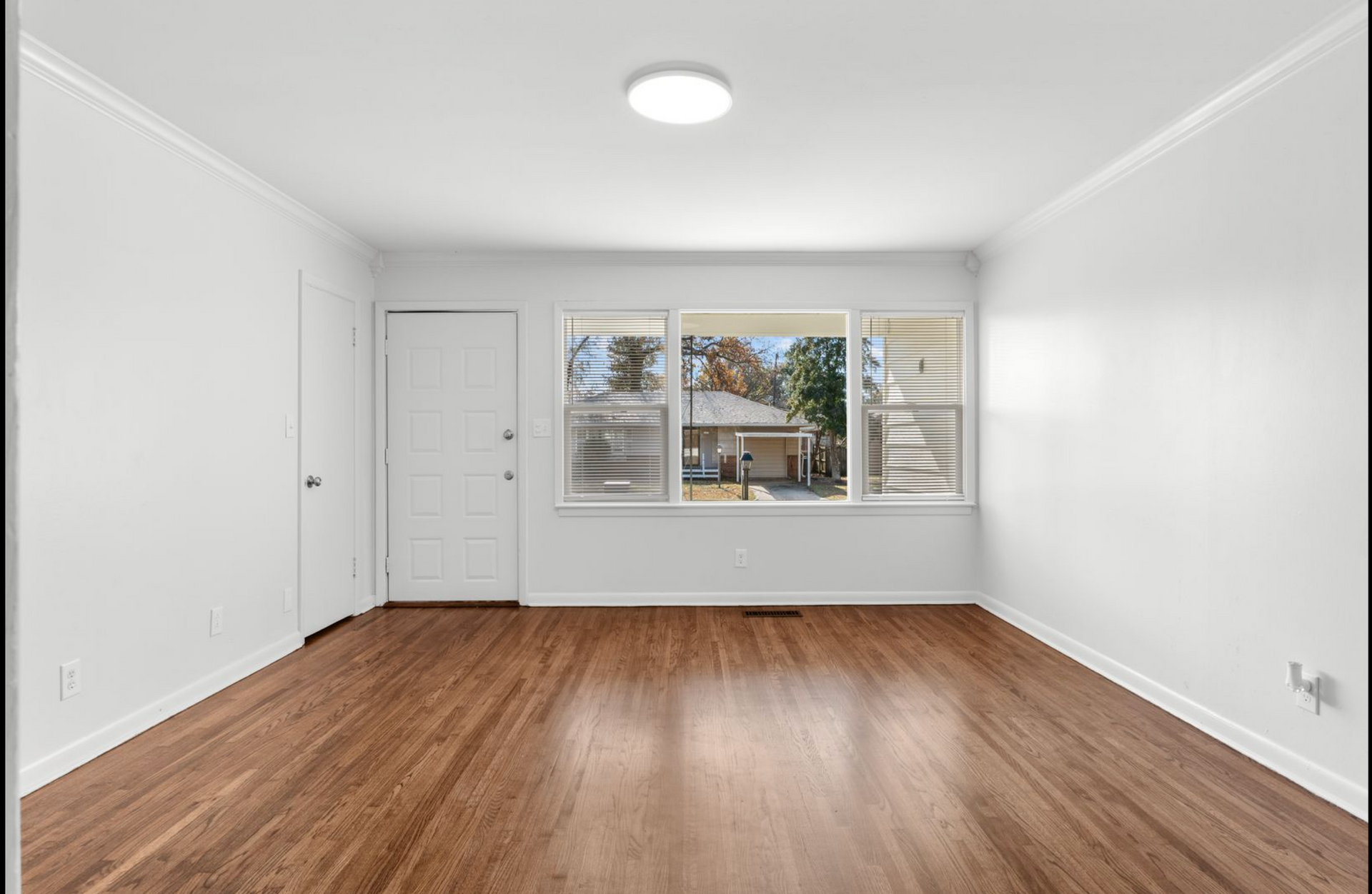 Property manager meeting with a homeowner to discuss single-family home property management services in Tulsa, including leasing, rent collection, maintenance coordination, and financial reporting. Tenant using a computer to communicate with property management and submit a maintenance request for a single-family rental home managed by KSA Property Management in Tulsa, Oklahoma