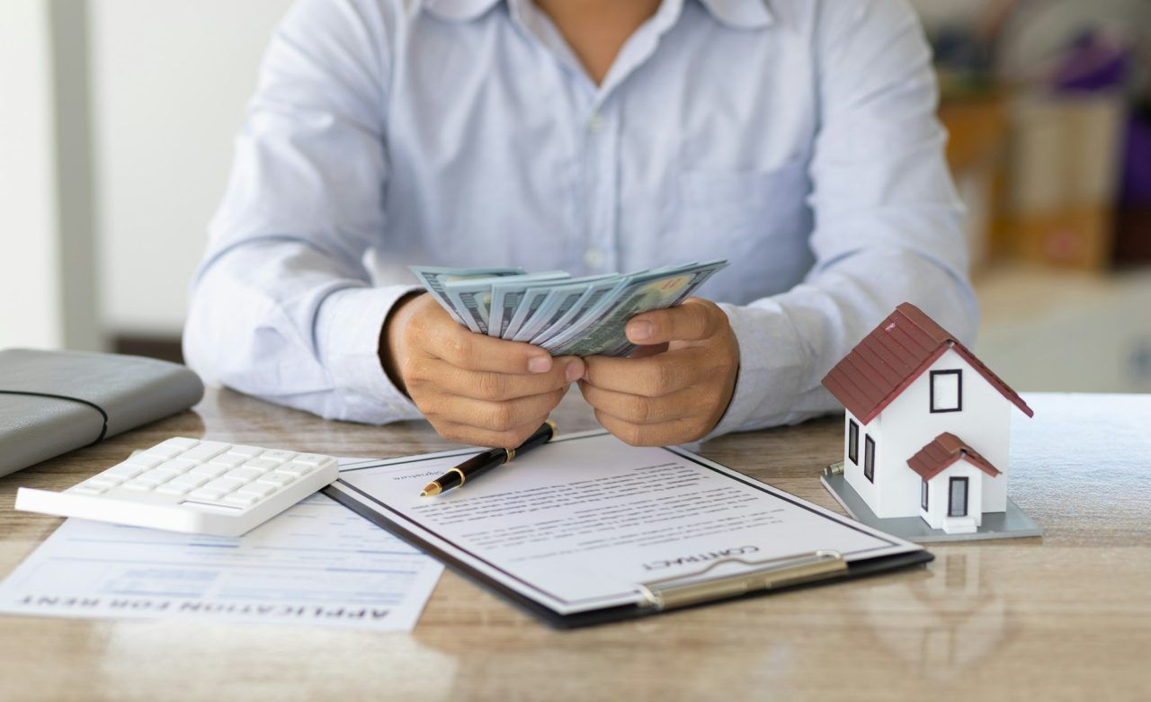 Property owner reviewing detailed financial reports and rental income statements for a professionally managed property in Tulsa, Oklahoma with KSA Property Management