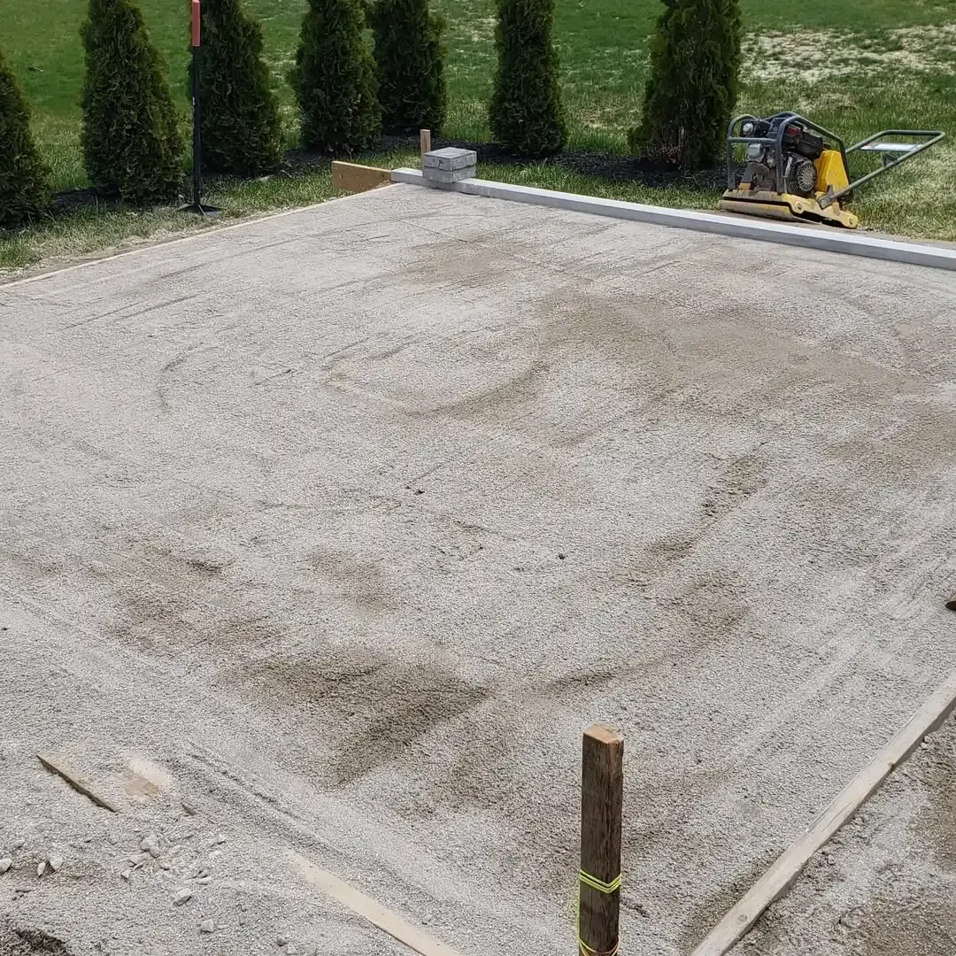 A pile of gravel is sitting on top of a dirt field.