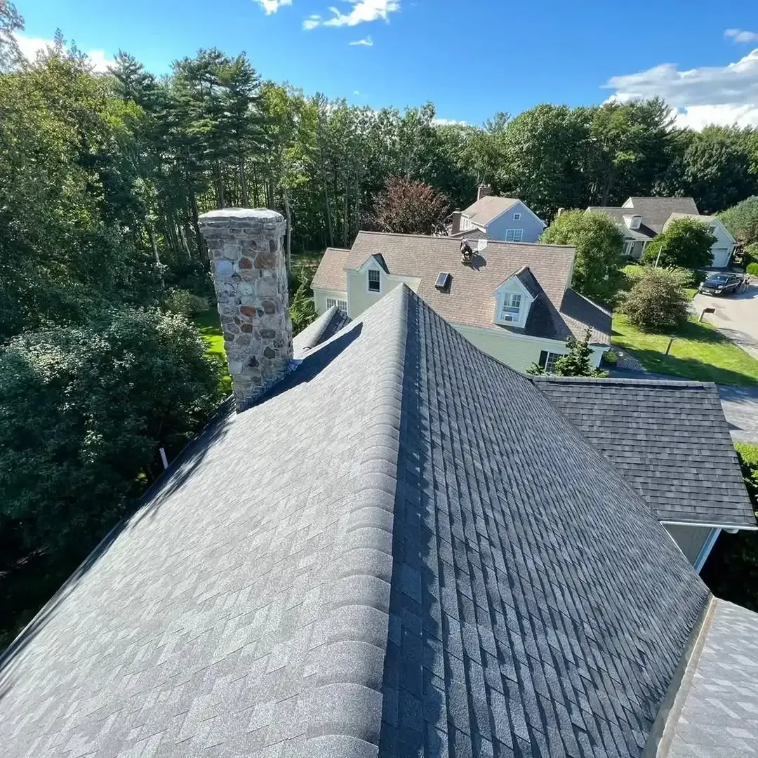 An aerial view of a house with a chimney on the roof.