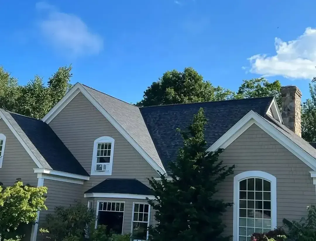 A house with a blue sky in the background