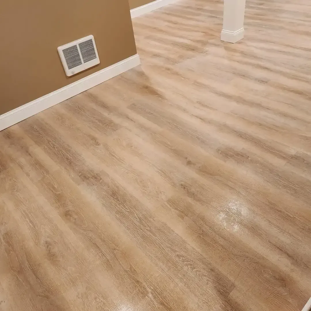 A close up of a wooden floor in a room.