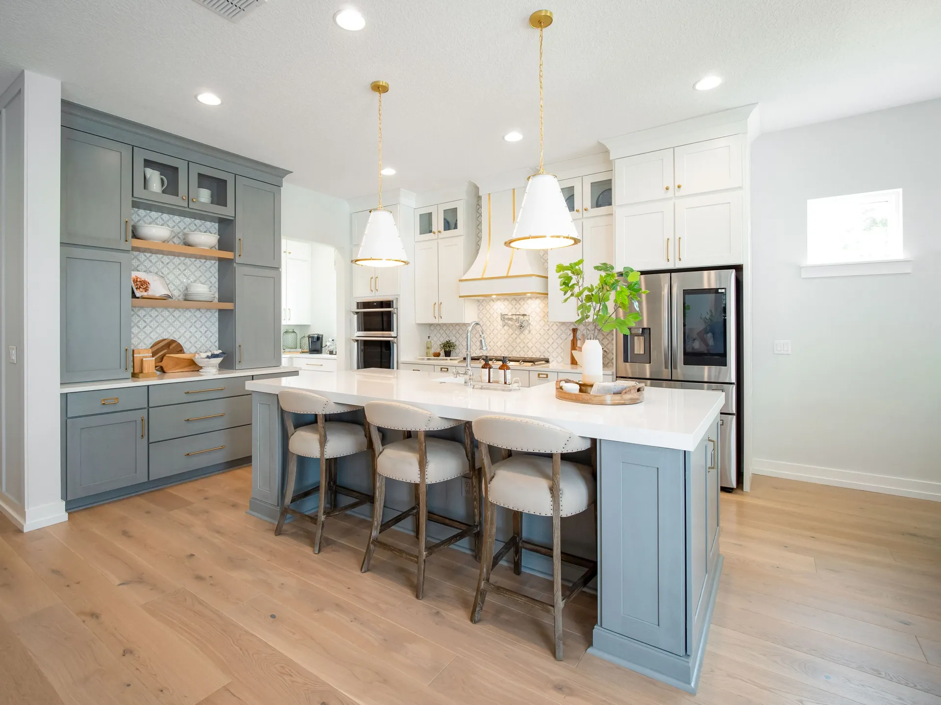 Beautiful kitchen with decorative accents of gold and stone grey colors