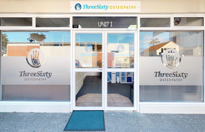 ThreeSixty Osteopathy clinic storefront with frosted logo on glass doors and windows.