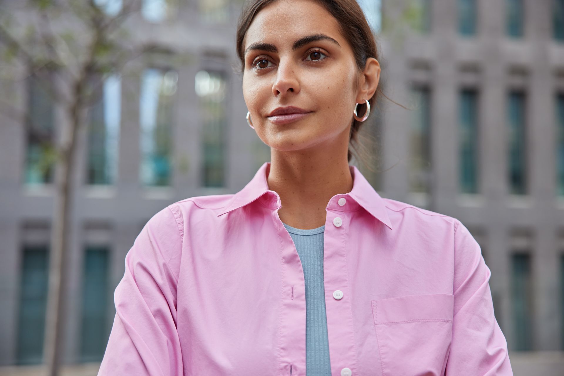 beautiful woman in pink shirt with clear skin
