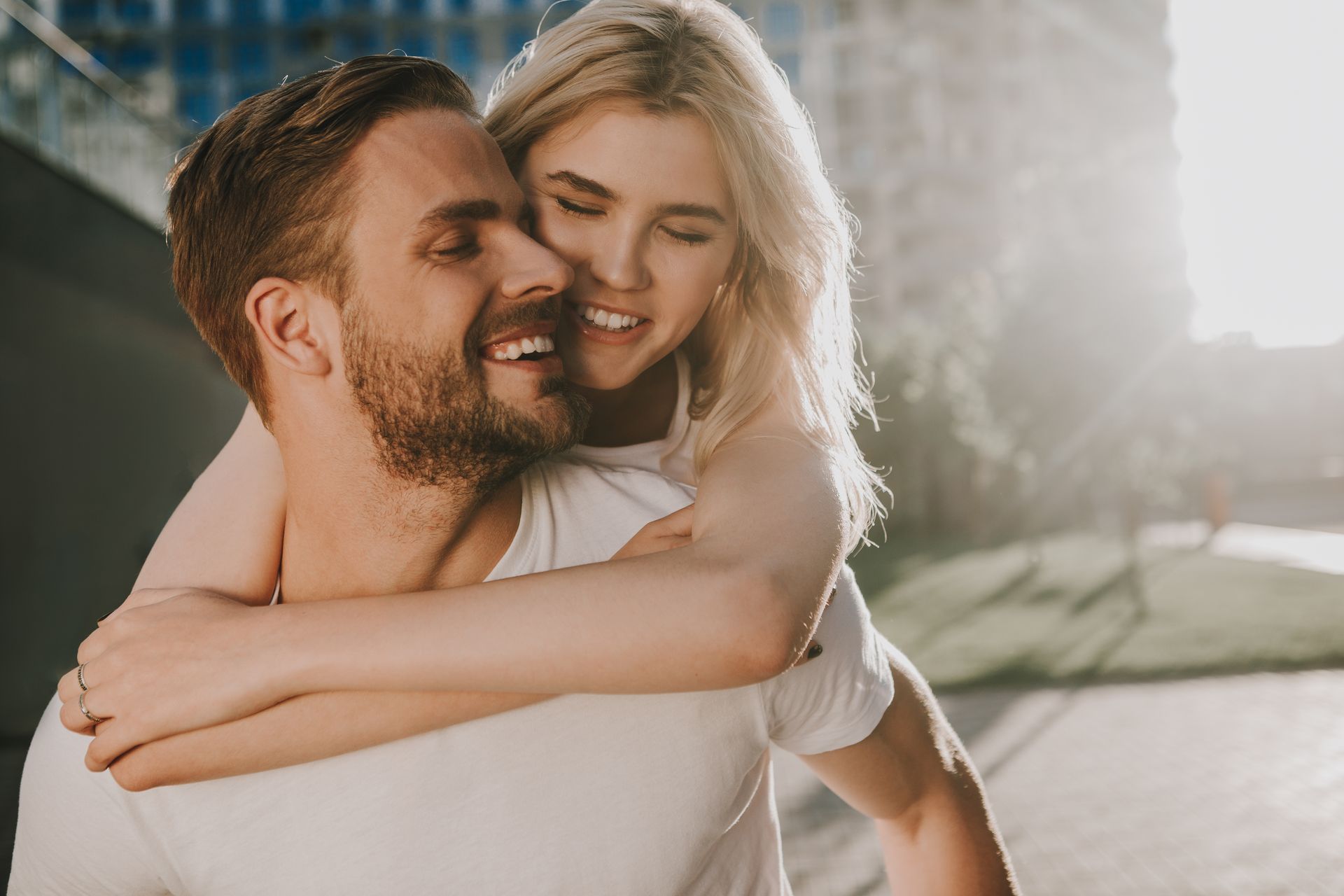Woman receiving facial skin treatment from a person in a white coat.