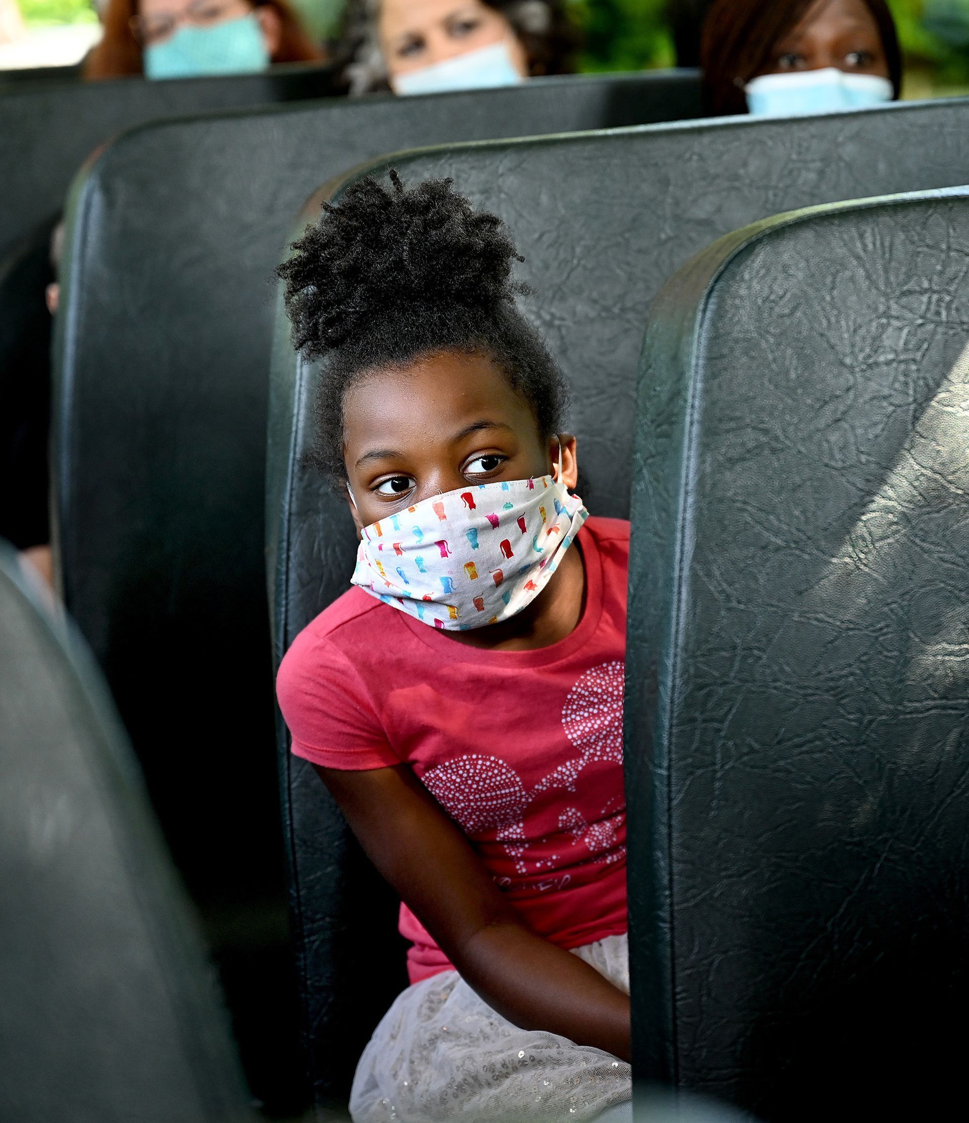 Megan Birch, an incoming third grader, rides the school bus to the Brookside Elementary School in Milford during a simulated school day organized by the school district to demonstrate social distancing protocols in response to the coronavirus pandemic, on Friday, August 21, 2020.