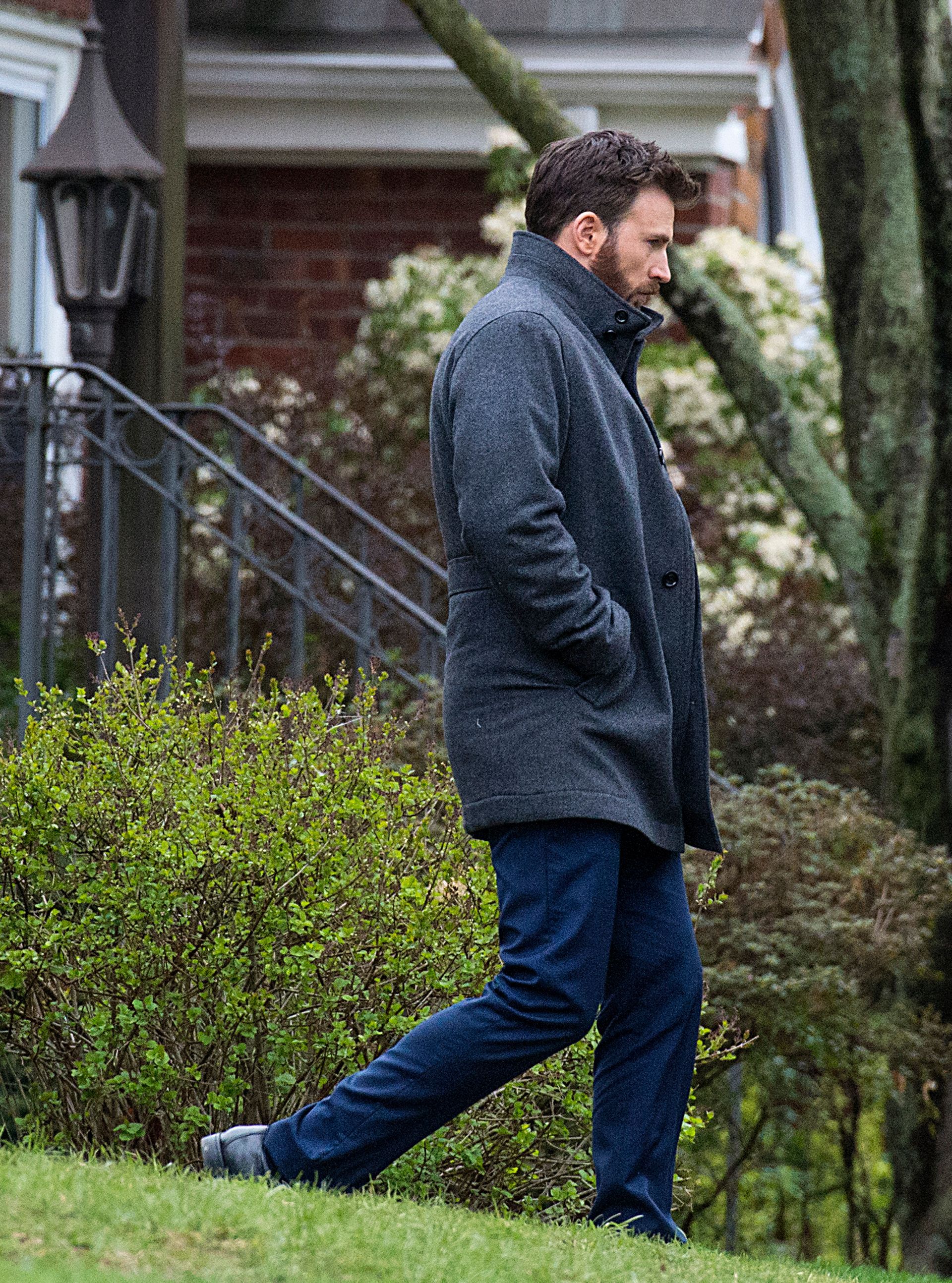 Captain America actor Chris Evans is bundled up for the cold during a break filming the Apple TV+ series “Defending Jacob” at 16 Ivy Road in Belmont April 30, 2019.