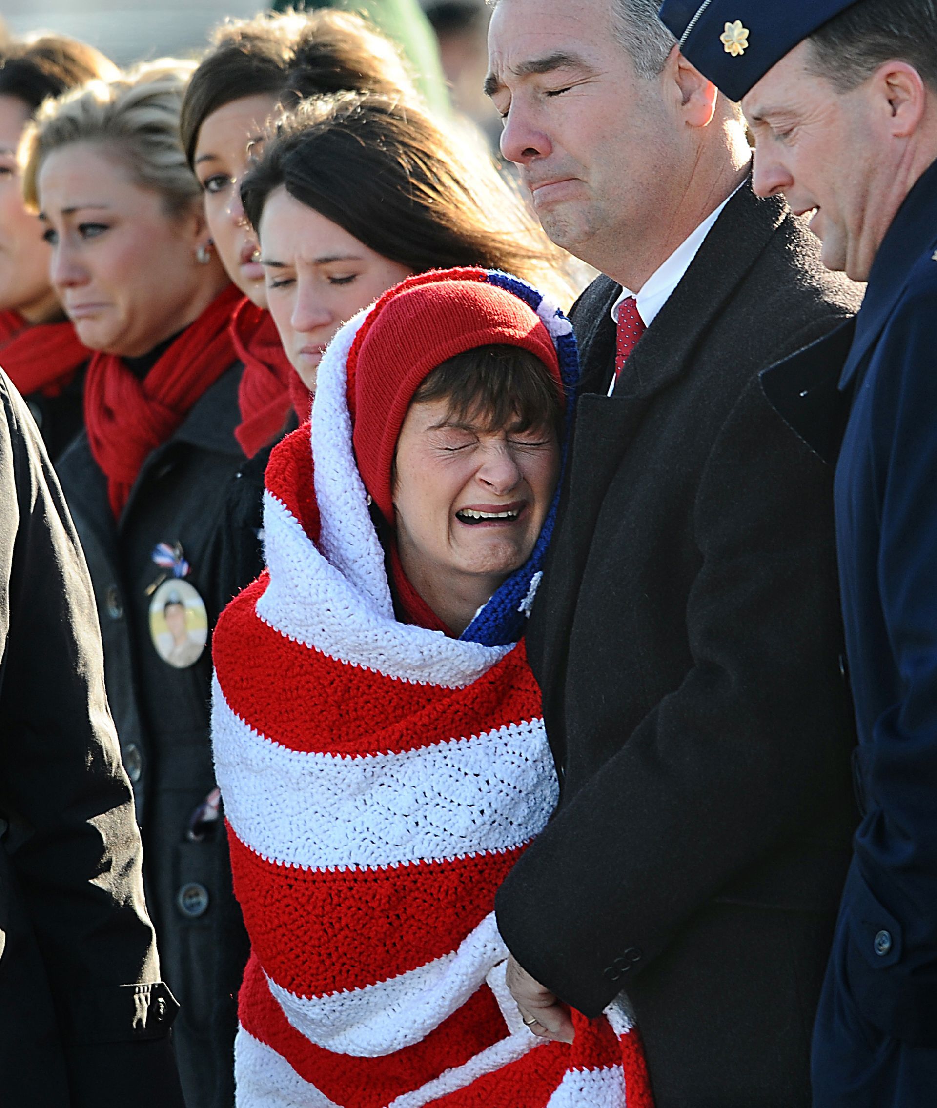 Janice Milley is overcome with grief as a plane carrying the body of her son, Army Lt. Scott Milley of Sudbury, arrives at Hanscom Air Force Base in Bedford on Dec. 9, 2010. Lt. Milley, an Army Ranger, died in combat in Afghanistan.