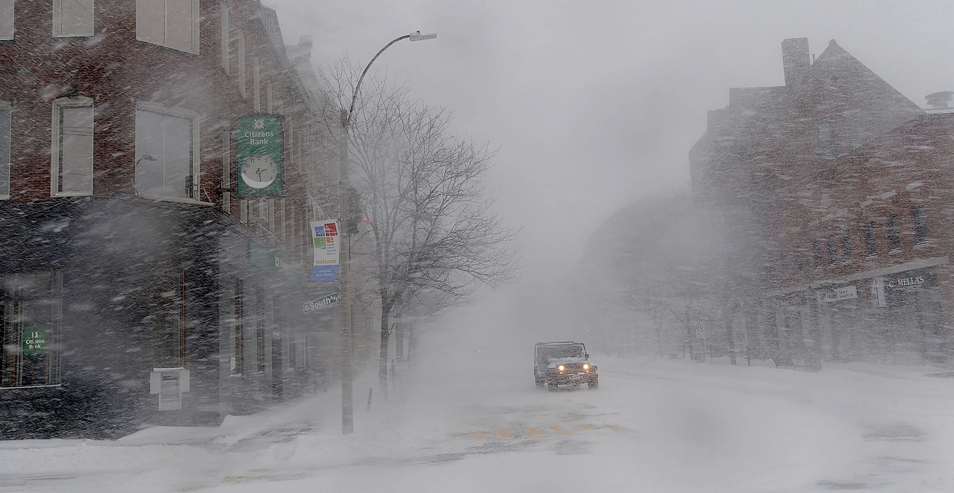A lone jeep passes through downtown Natick in whiteout conditions as major winter storm kept most motorists off the streets on February 9, 2017.