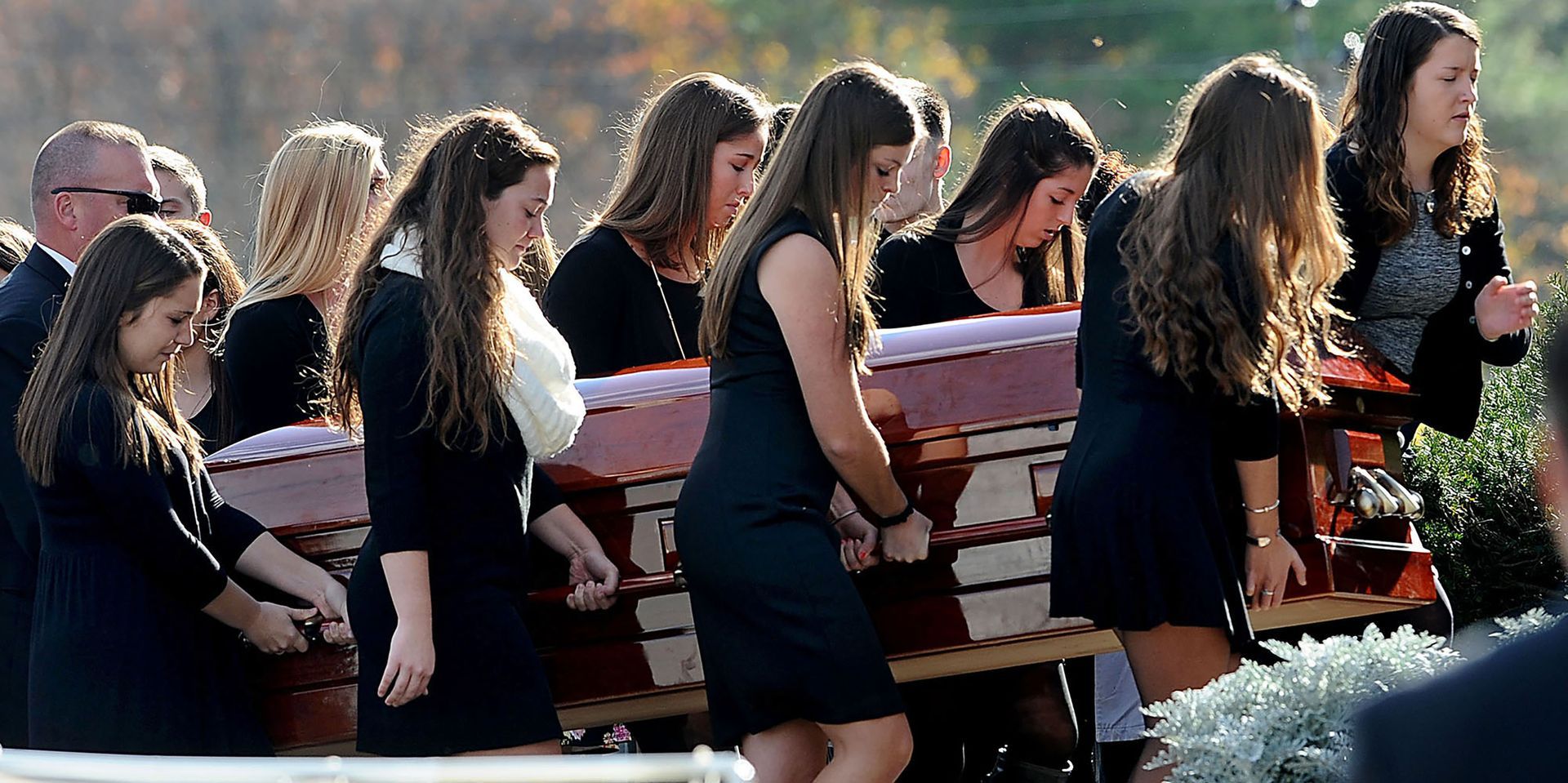 Serving as pallbearers, teammates of Madeline “Maddie” Lamson carry her casket into St. Joseph’s Church in Medway for a funeral service Thursday, November 5, 2015. Lamson, 17, a three-sport athlete and senior at Medway High School, was killed in a car crash the previous Friday night.