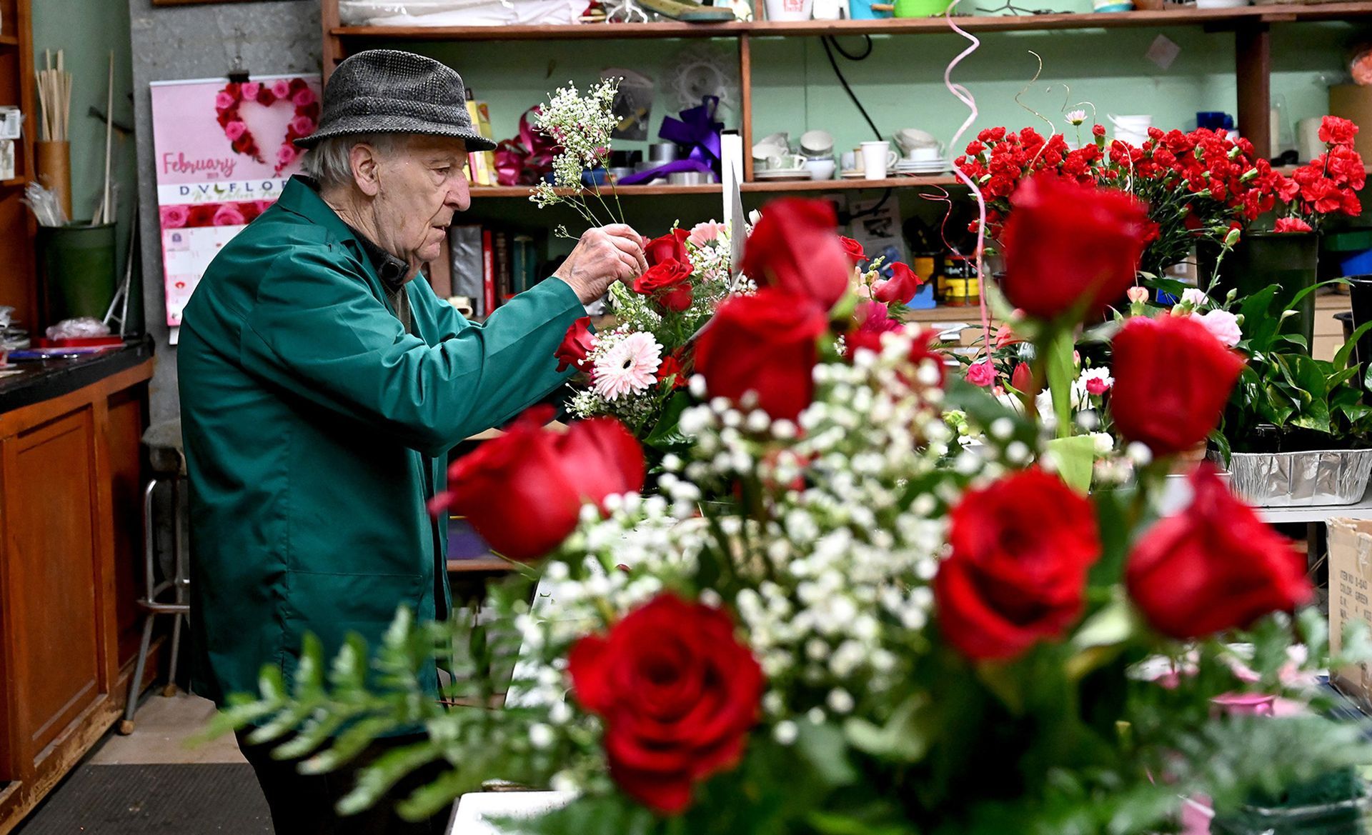 Francis Iacovelli, 91, patriarch of the family-owned Francis Flowers on Prospect Street in Milford, creates a Valentine's Day rose arrangement for a customer in his shop Wednesday afternoon, Feb. 13. Iacovelli founded the business in 1949 in Milford when he was 19.