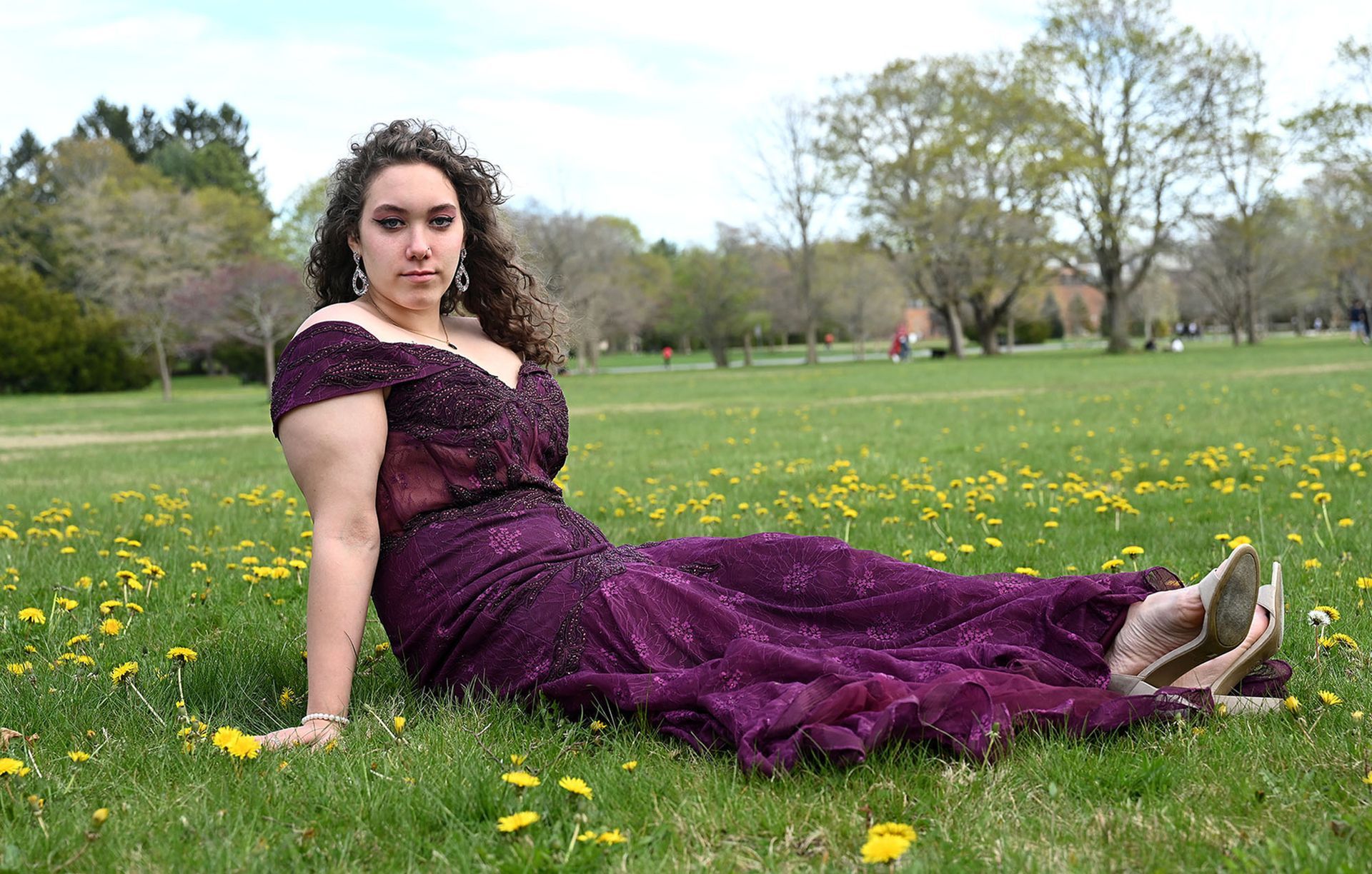 Framingham High School senior Jacqueline De La Rosa, 18 wears her in her prom dress at Cushing Memorial Park Saturday, May 2 2020. Prom was canceled because of the coronavirus pandemic but De La Rosa had already bought the dress.
