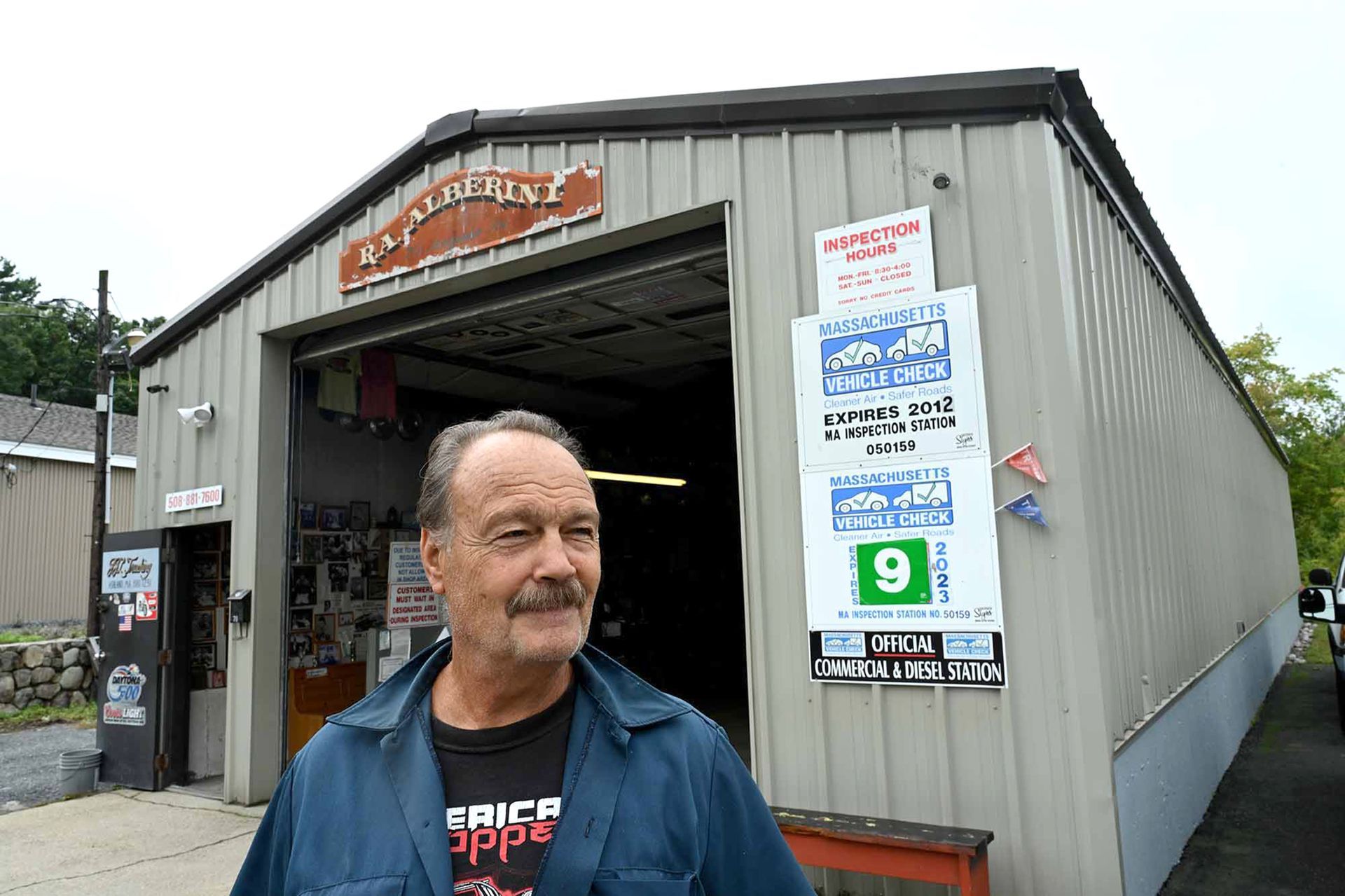 Rick Alberini, owner of Alberini Inpsection Services, poses outside his Ashland garage Sept. 20, 2022. Alberini specializes in inspections and said that some customers come in expecting a new inspection sticker even while driving without a muffler or on bald tires.