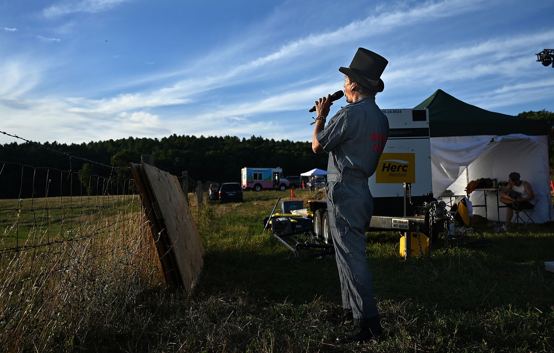 Warming up for his Eastleigh Farm performance is ringmaster Curtis Howard, August 12, 2022. The troupe of ten circus performers from New York-based Hideway Circus stopped in Framingham for three nights as part of a Northeast tour.
