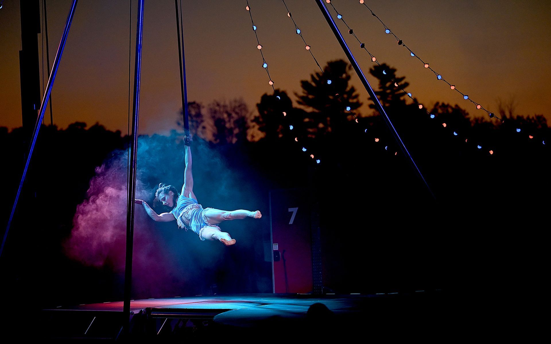 Aerialist Lindsay Culbert-Olds of Arlington performsduring an evening performance of Stars Above, an open air circus on a circular stage that combines contemporary and classical circus, at Eastleigh Farm in Framingham, August 12, 2022.