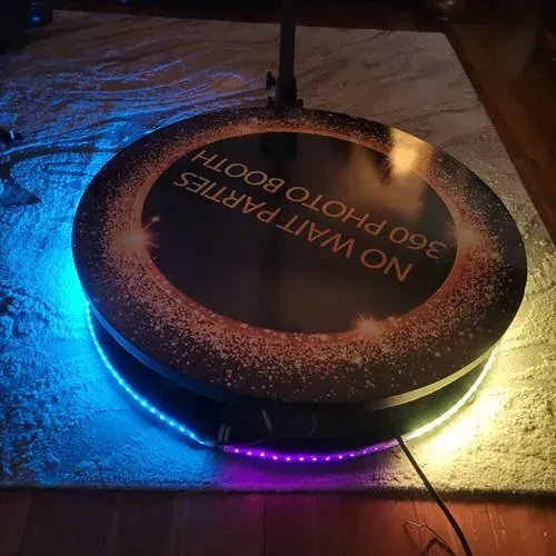 a 360 photo booth is sitting on a wooden floor