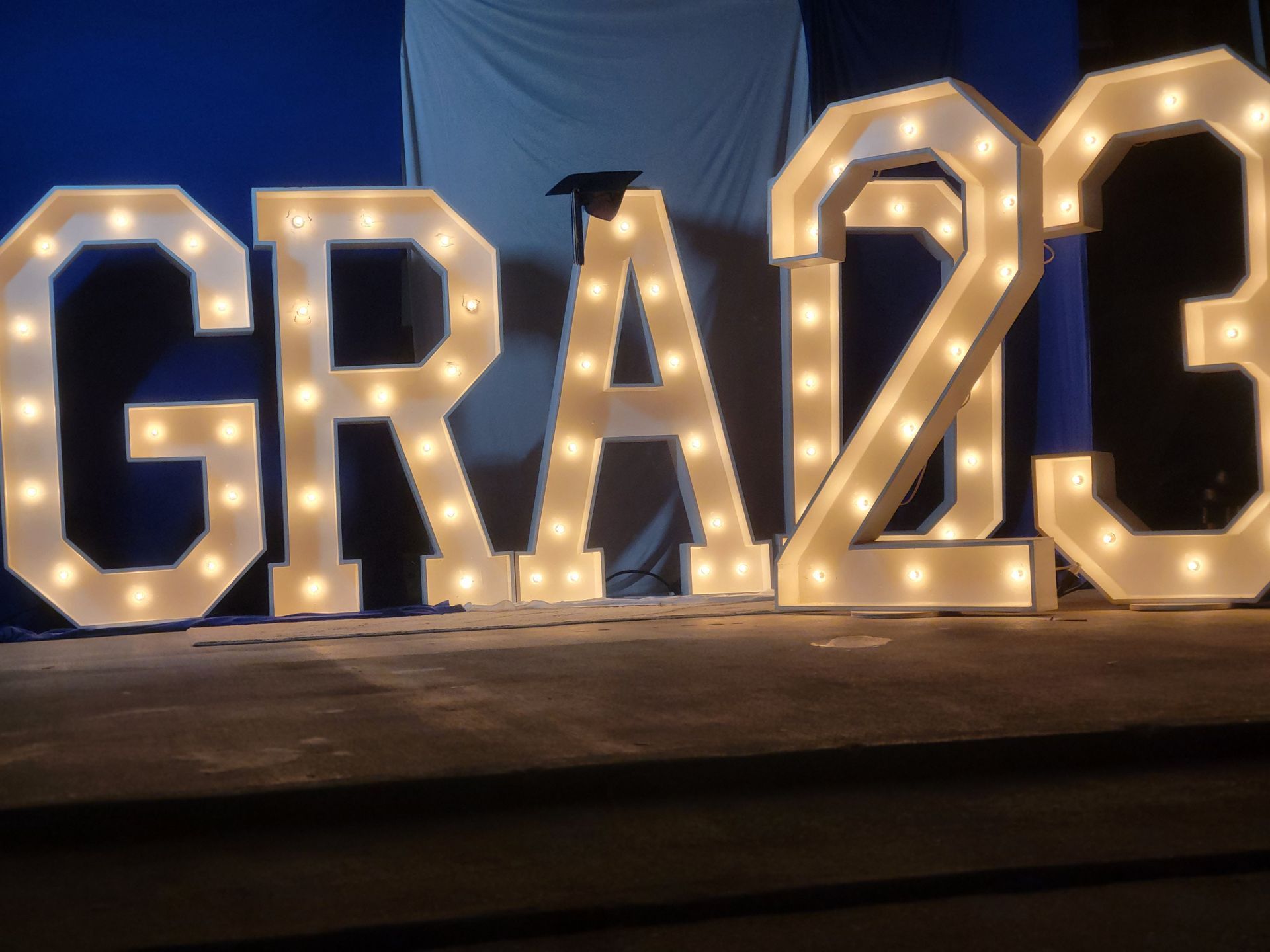 the letters graz are lit up in the dark