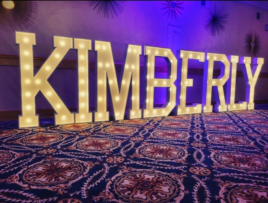 the word kimberly is lit up in large letters