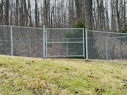 Wire fence installed by Kingdom Fence Company, offering durable and effective boundary solutions.