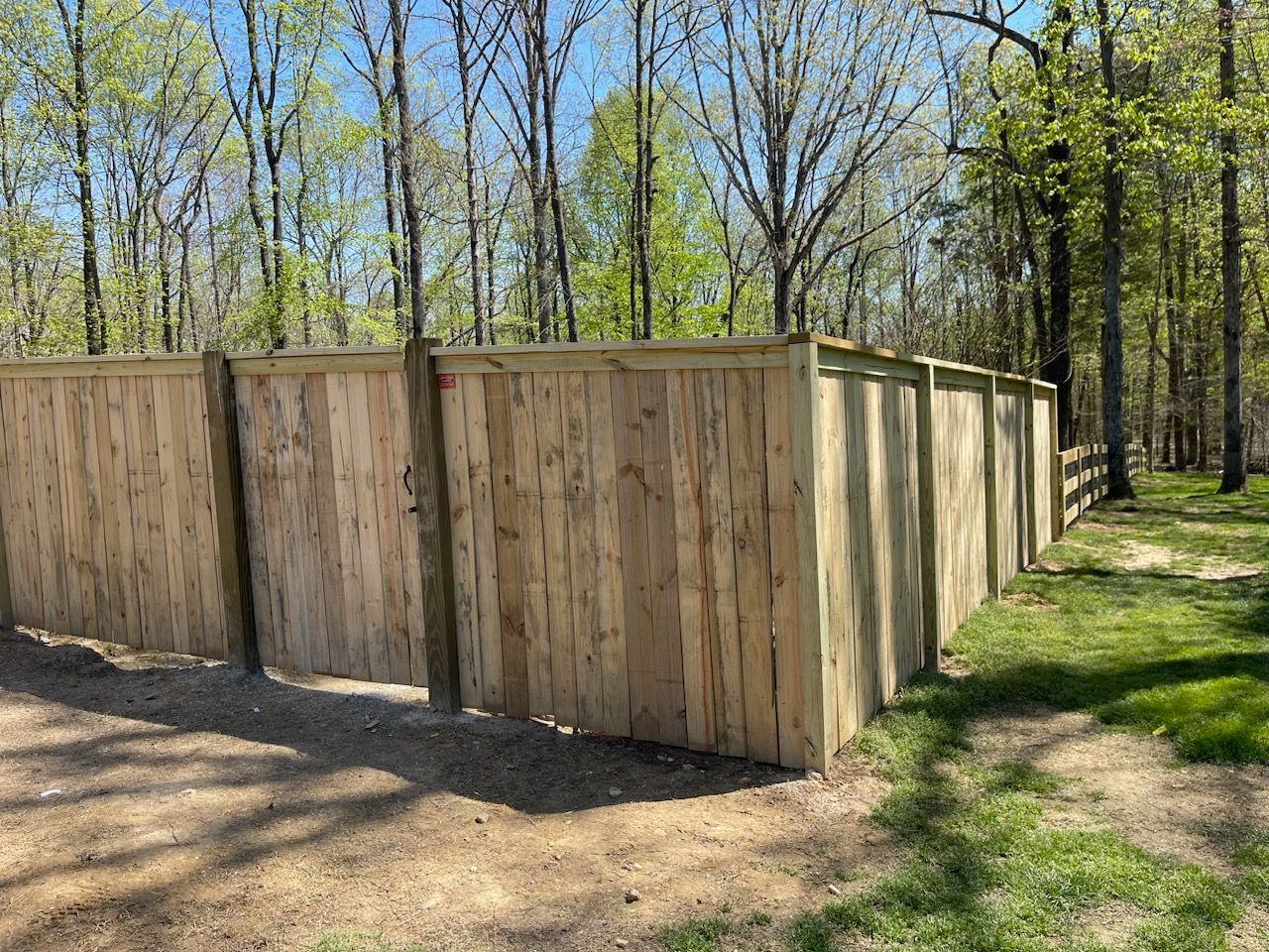 Residential privacy fence installed by Kingdom Fence Company, providing secure and private outdoor space.