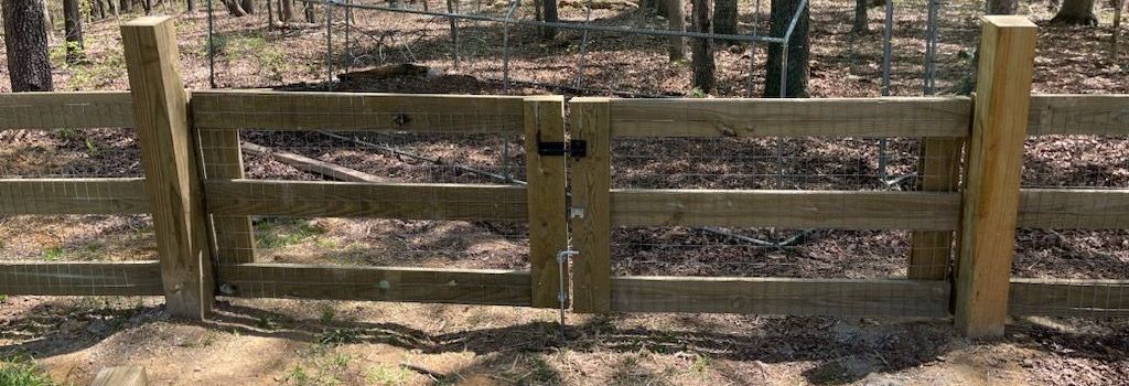 3-board fence with wire installed by Kingdom Fence Company, offering durable and secure fencing.