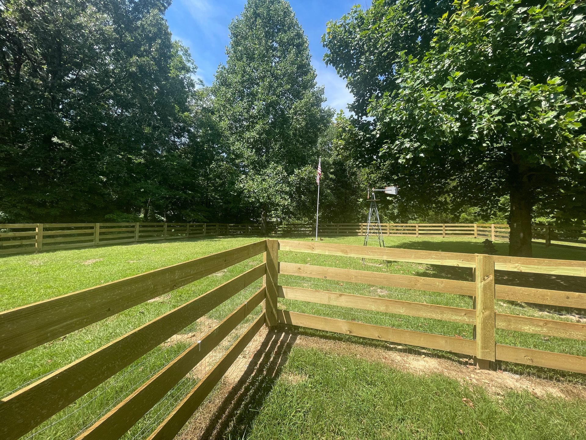 4-board fence by Kingdom Fence Company, featuring a traditional and durable design.