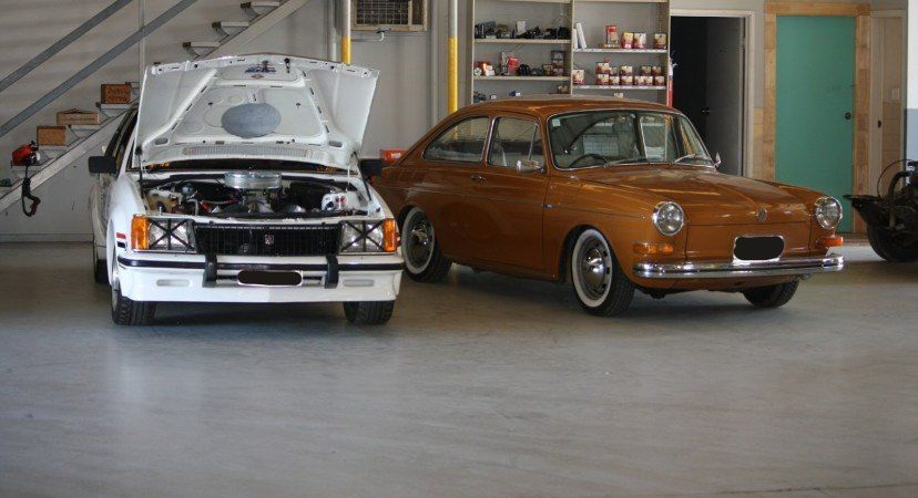 A White Car and a Brown Car Are Parked — All Mechanical Services in South Murwillumbah, NSW
