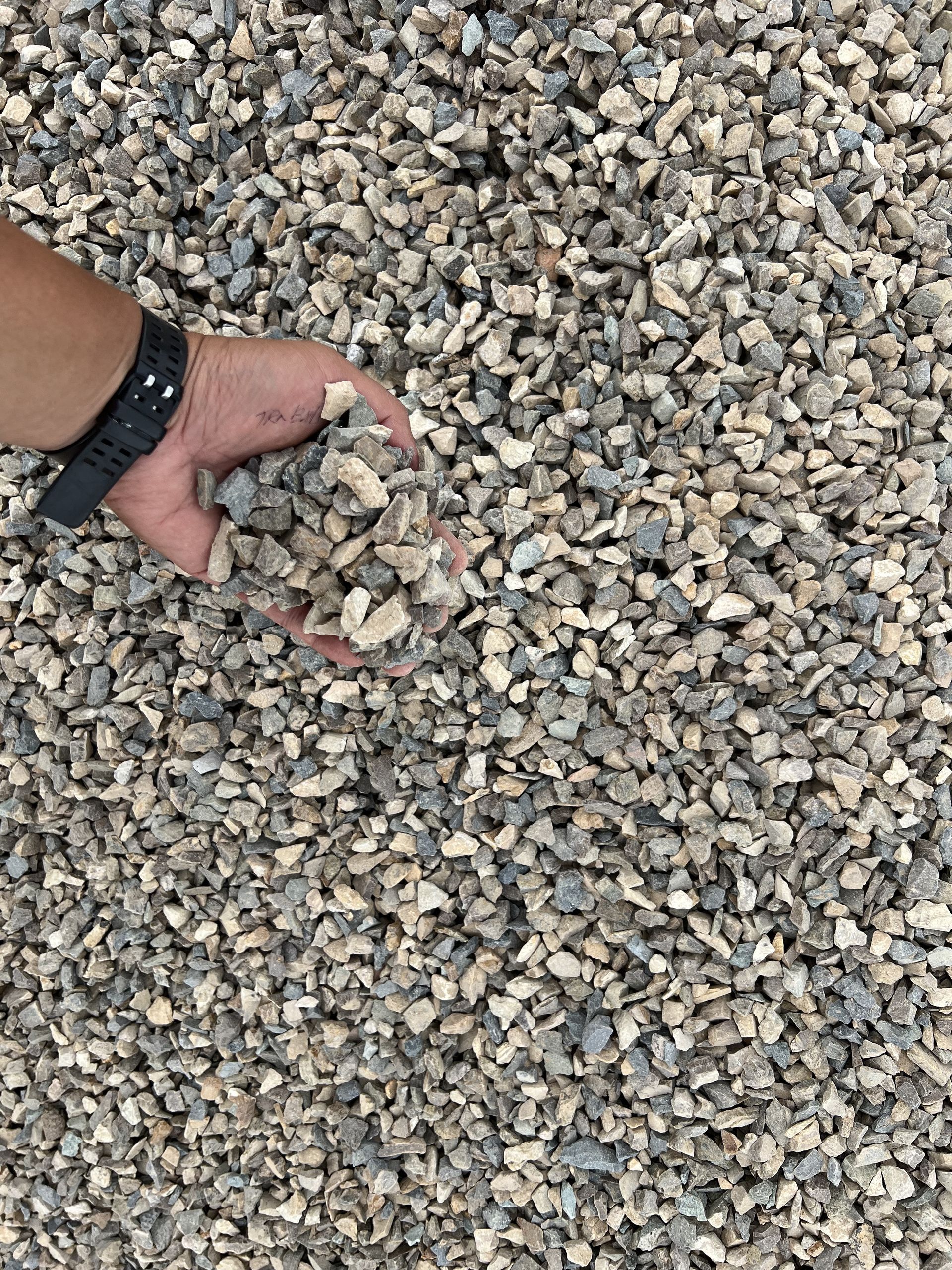 some picks up some rocks from s pile — W Wall & Sons in Nebo, QLD