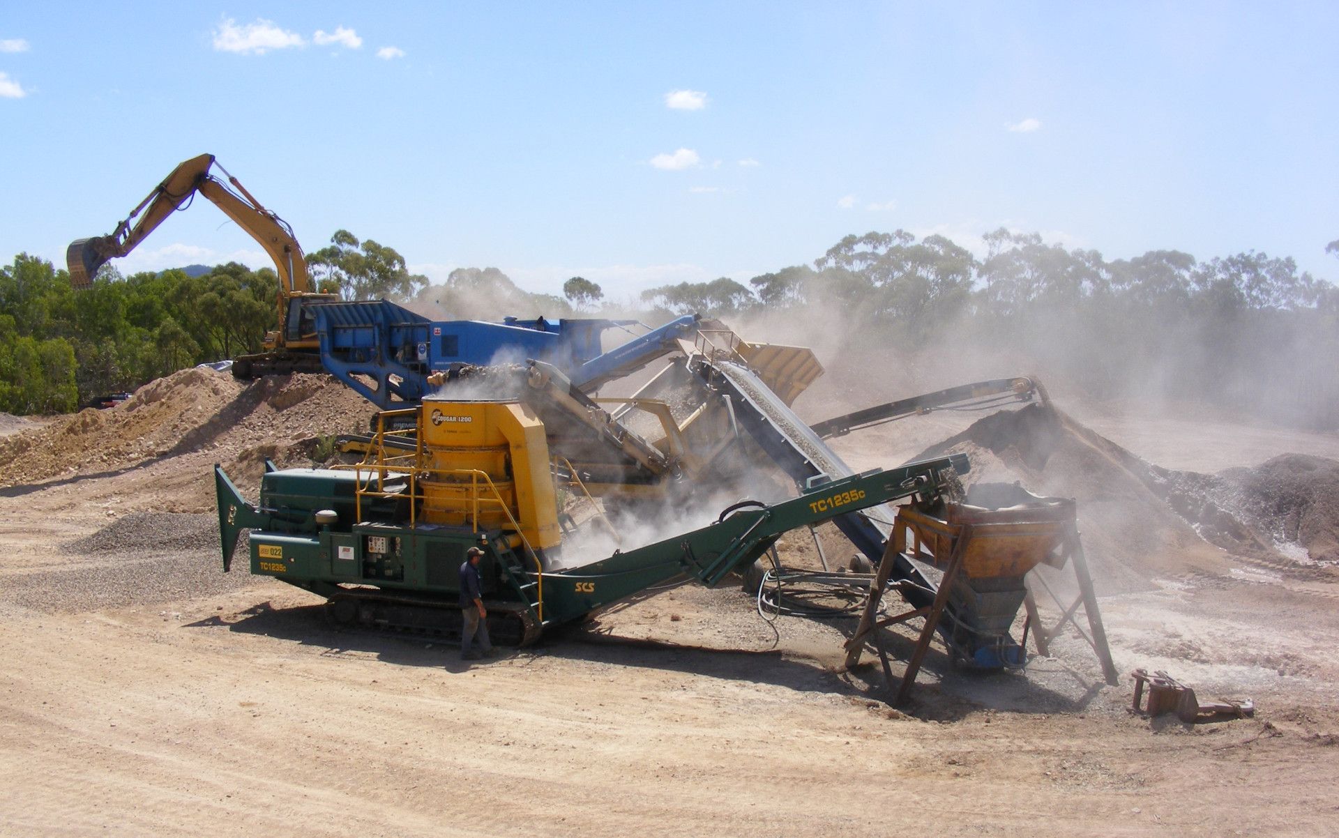 trucks in a quarry — W Wall & Sons In Cannonvale, QLD