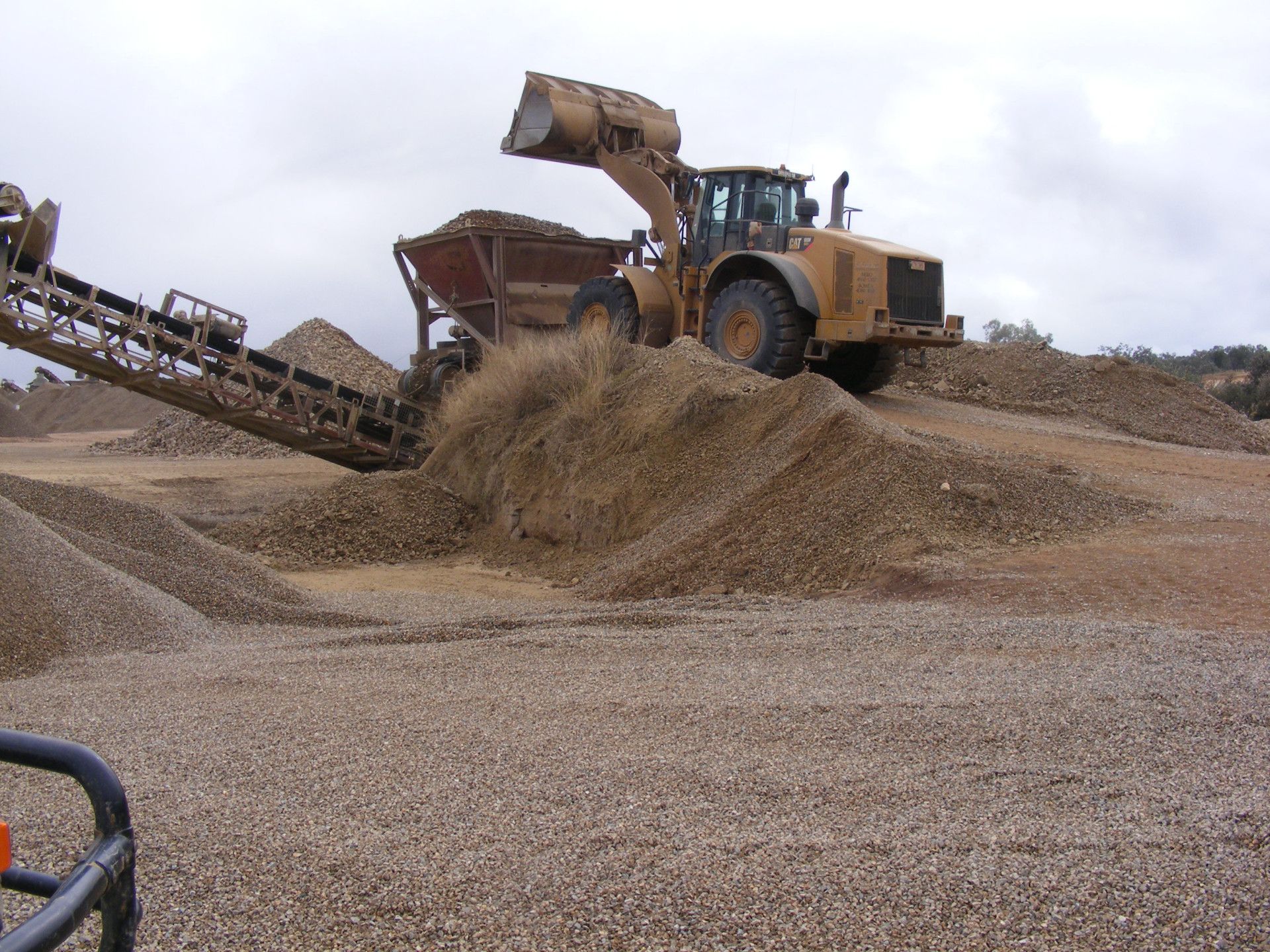 A Conveyor Belt Is Pouring Sand Into A Pile Of Sand — W Wall & Sons In Bloomsbury, QLD