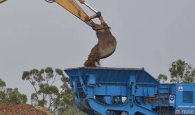 A Large Pile Of Gravel Is Sitting In The Middle Of A Dirt Field — W Wall & Sons In Bowen, QLD