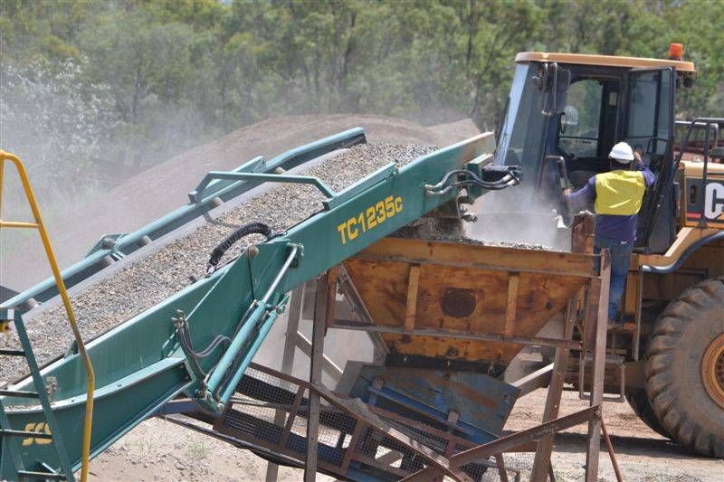 Loading Gravel Into A Conveyor Belt In A Quarry — W Wall & Sons In Airlie Beach, QLD