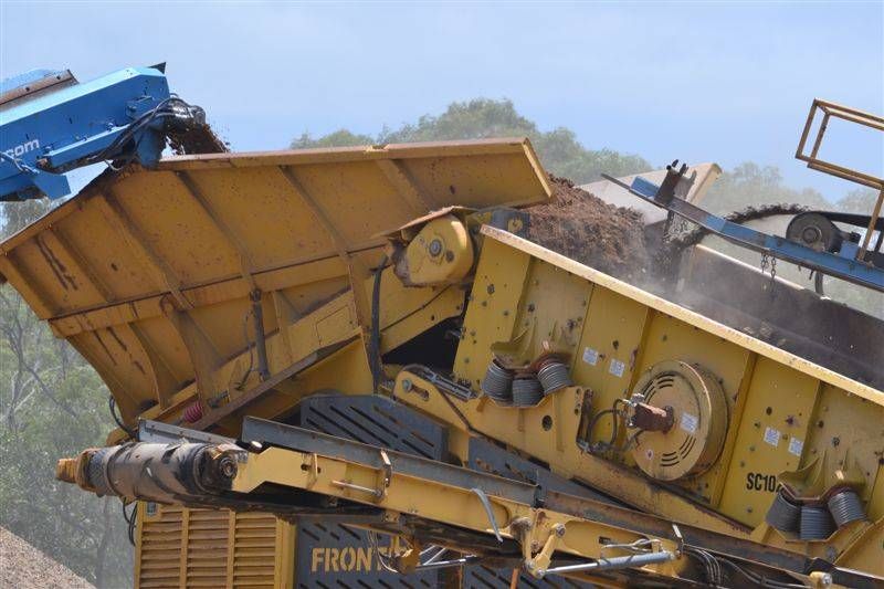 Pile of Gravel is Sitting is being poured into a truck— W Wall & Sons in Nebo, QLD