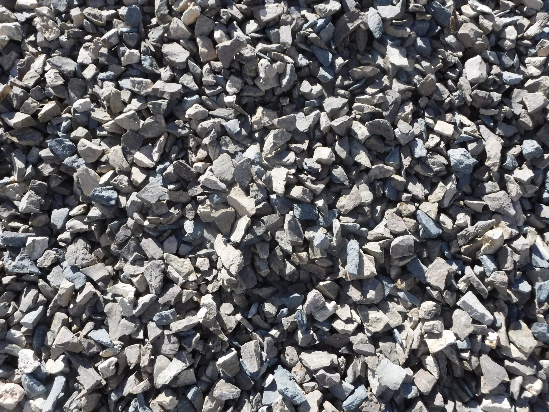 A Large Pile Of sand Is Sitting On Top Of A Dirt Field — W Wall & Sons In Glenden, QLD