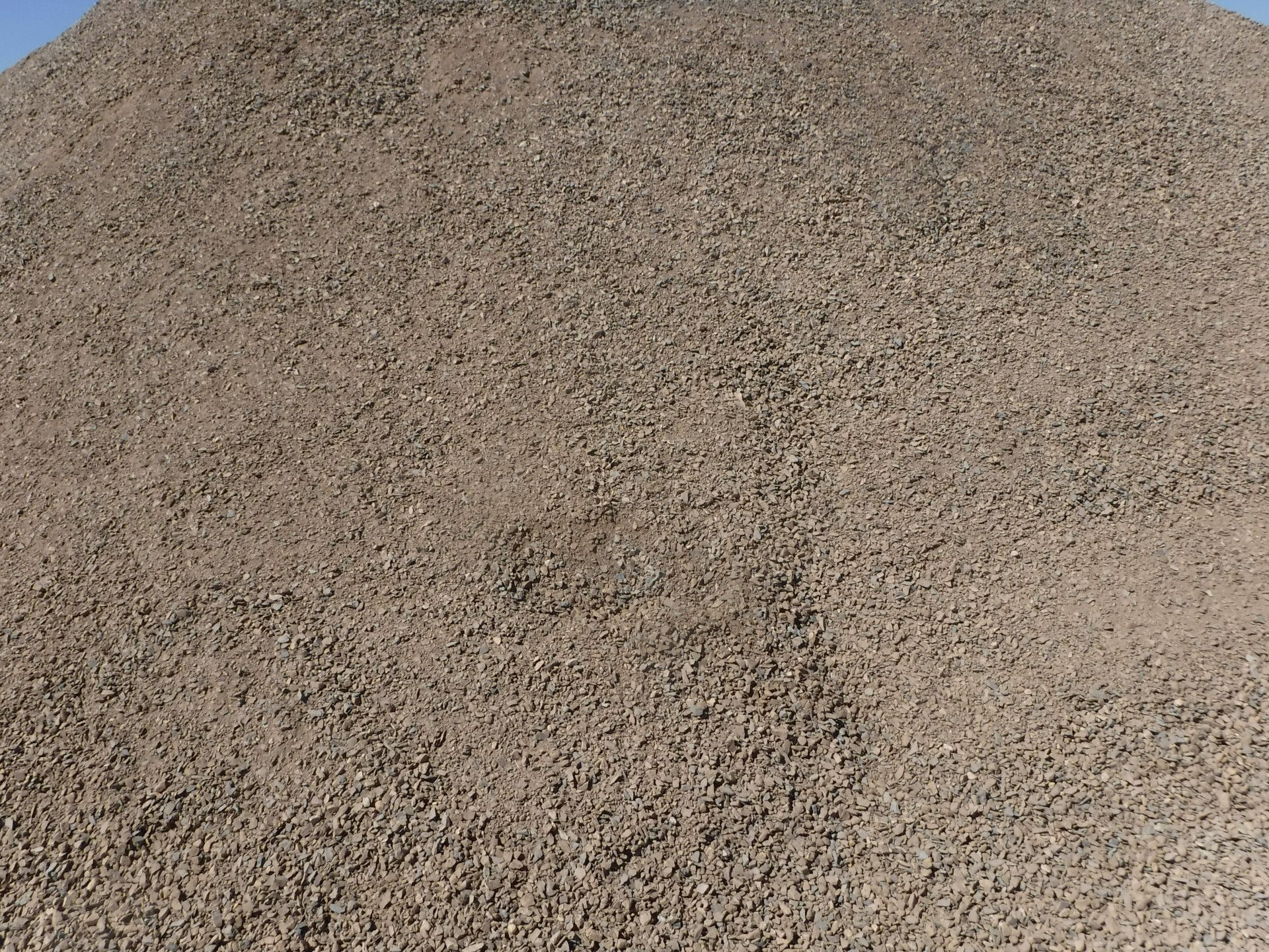 A Large Pile Of Rocks Is Being Processed By A Machine In A Quarry — W Wall & Sons In Marion, SA