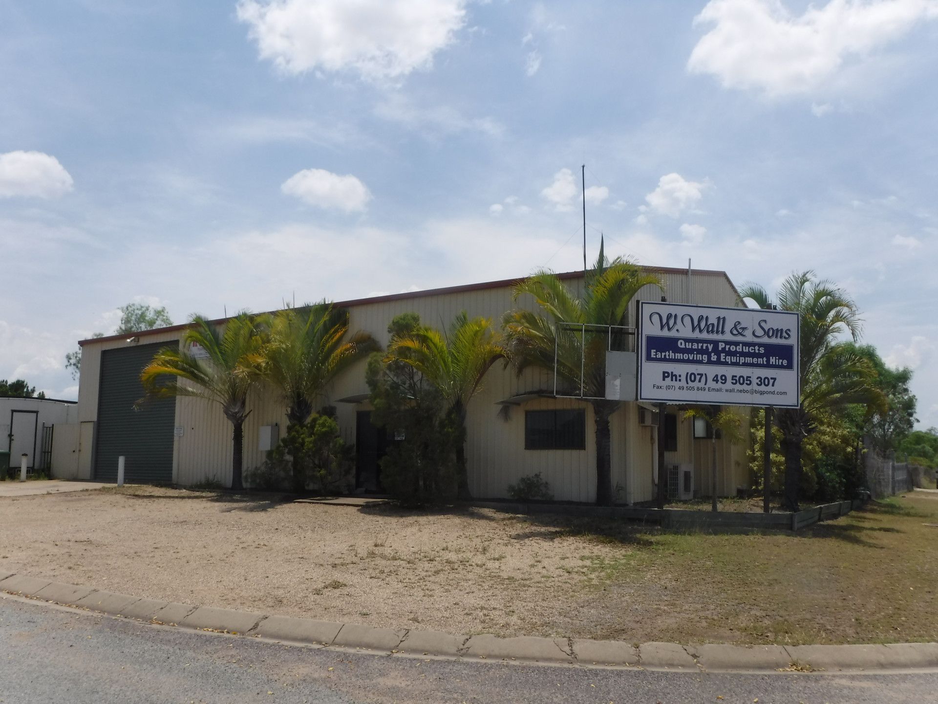 Industrial building with a sign for