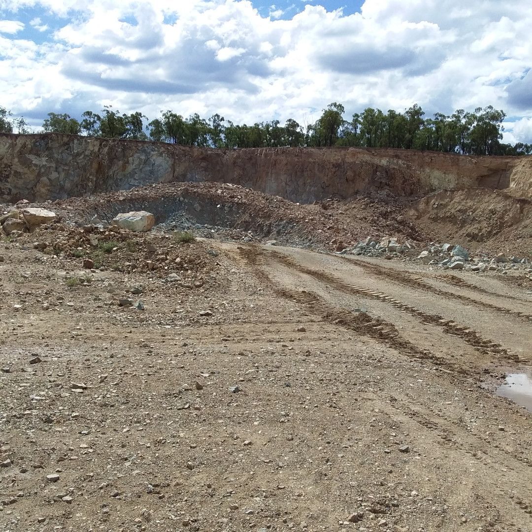 a dirt hill with trees in the background — W Wall & Sons in Nebo, QLD