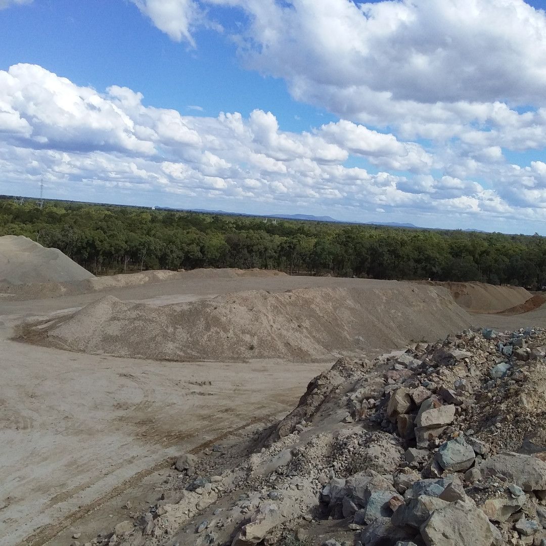 A Conveyor Belt Is Going Over A Pile Of Rocks — W Wall & Sons In Moranbah, QLD