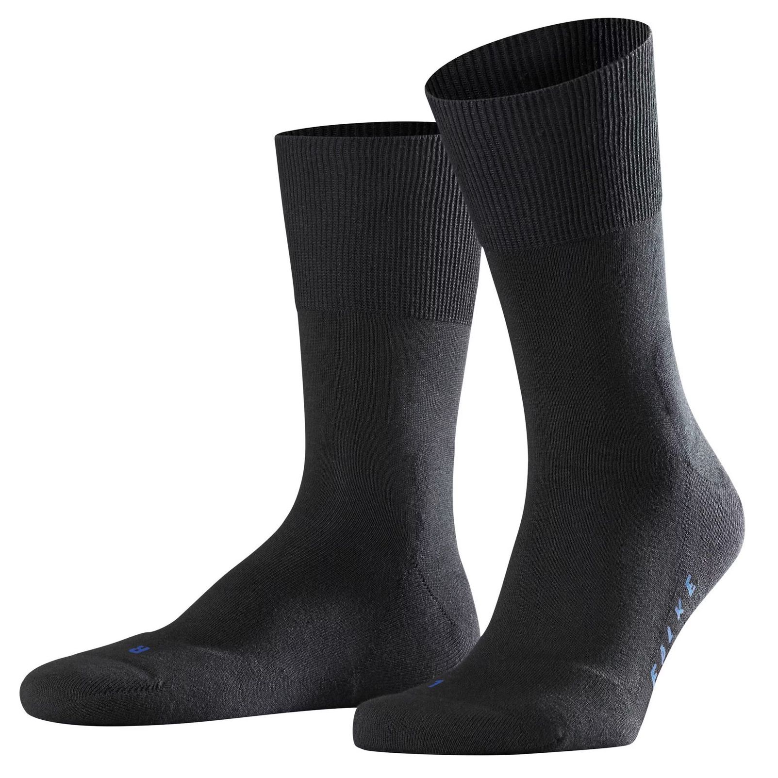A pair of black socks on a white background