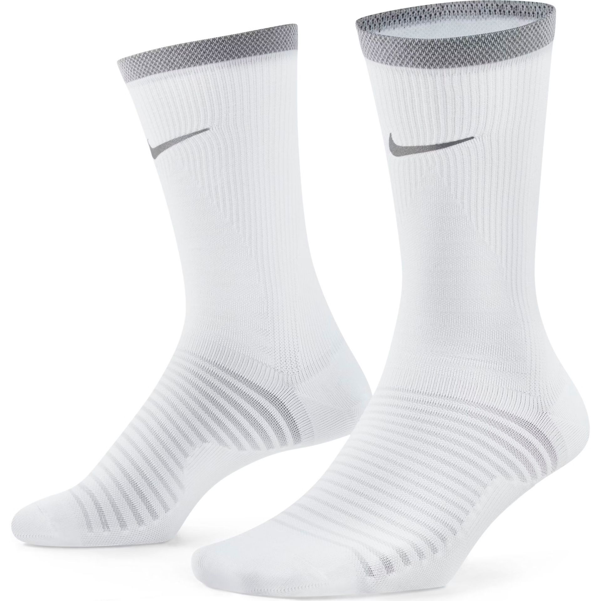 A pair of white nike socks on a white background