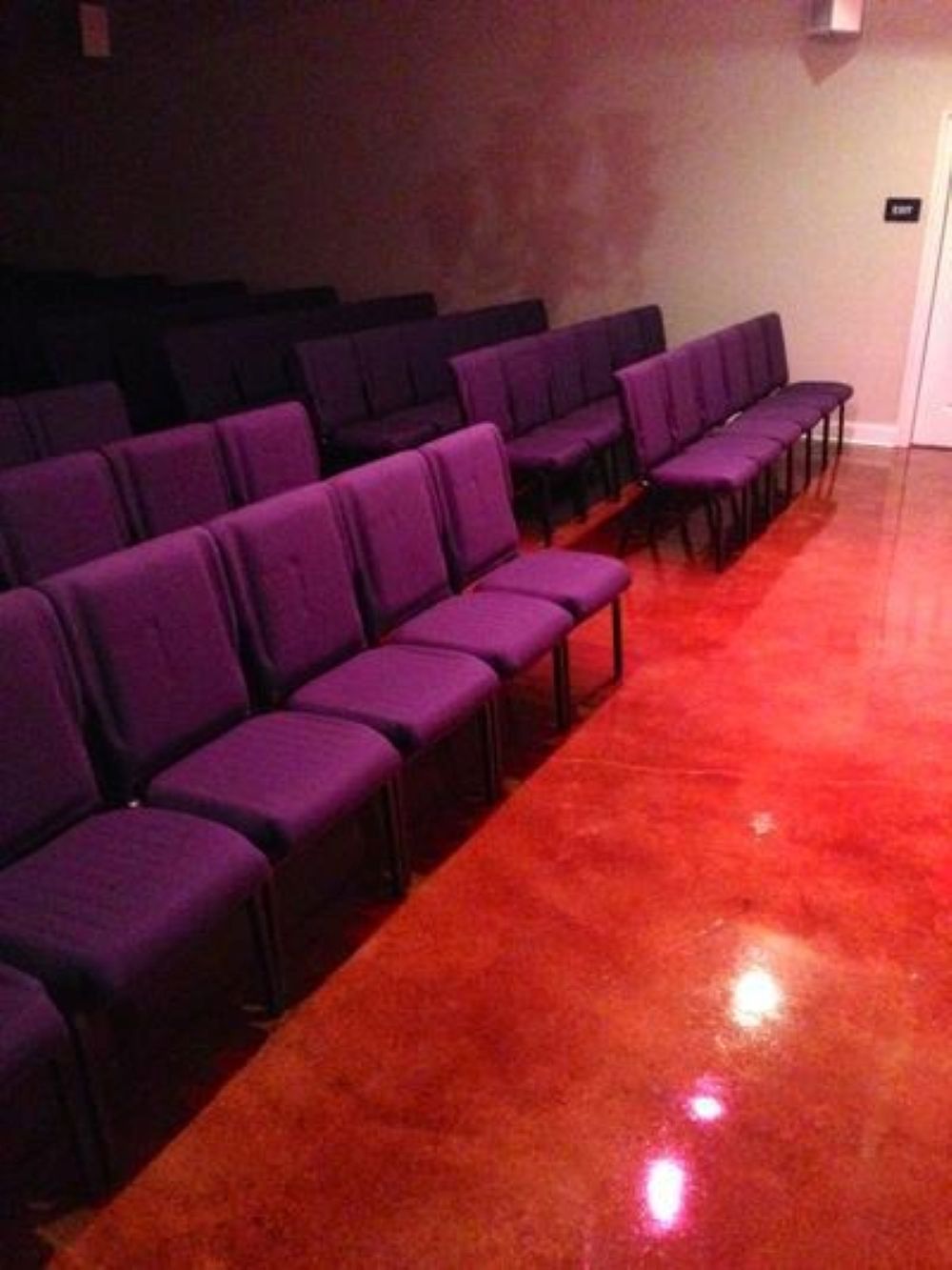 A black and white photo of a black leather couch.