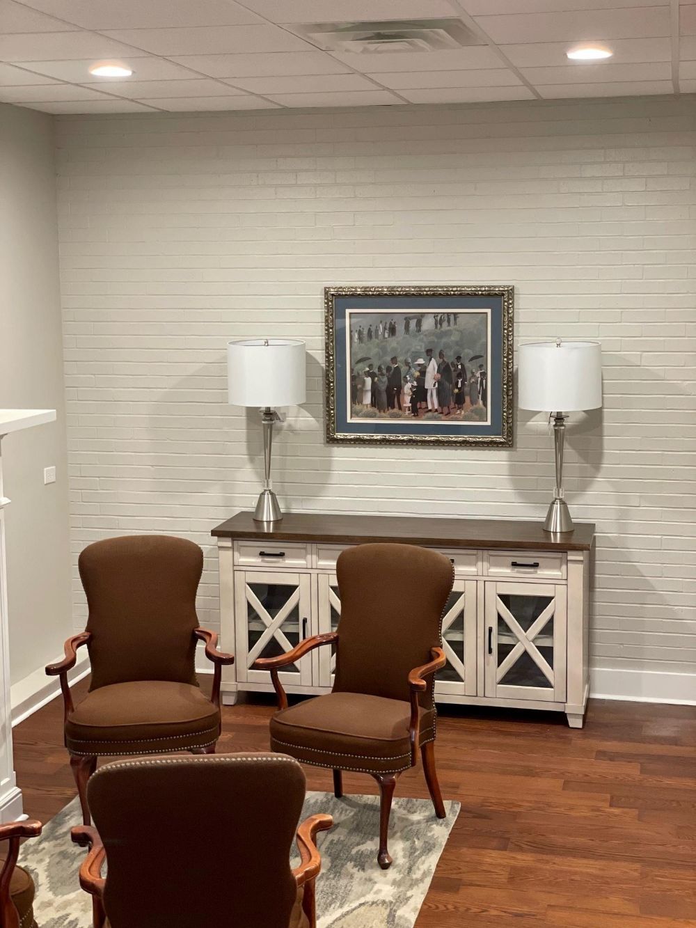A black and white photo of a black leather couch.